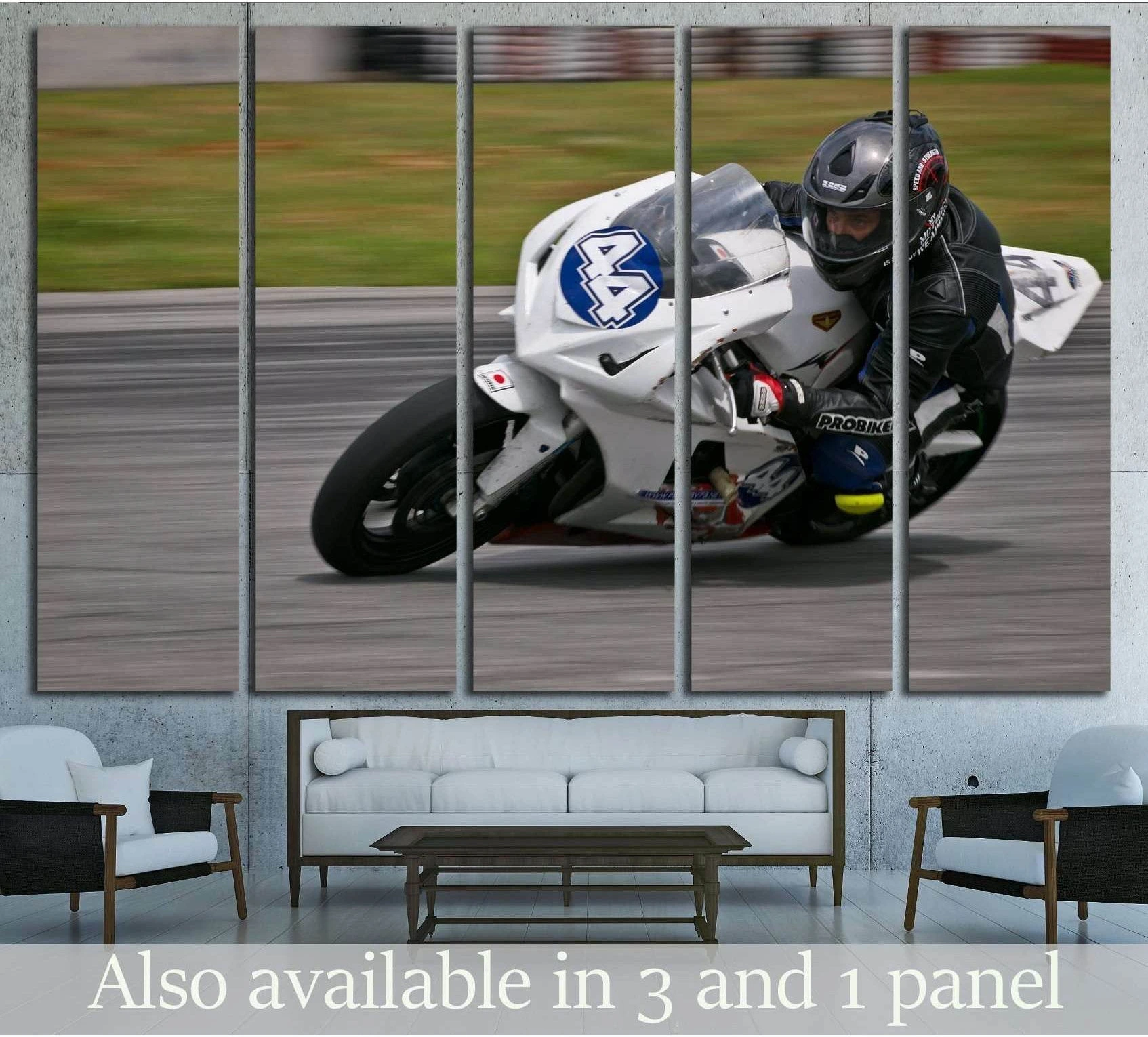 White sportbike racing canvas print displayed above a sofa in a modern living room