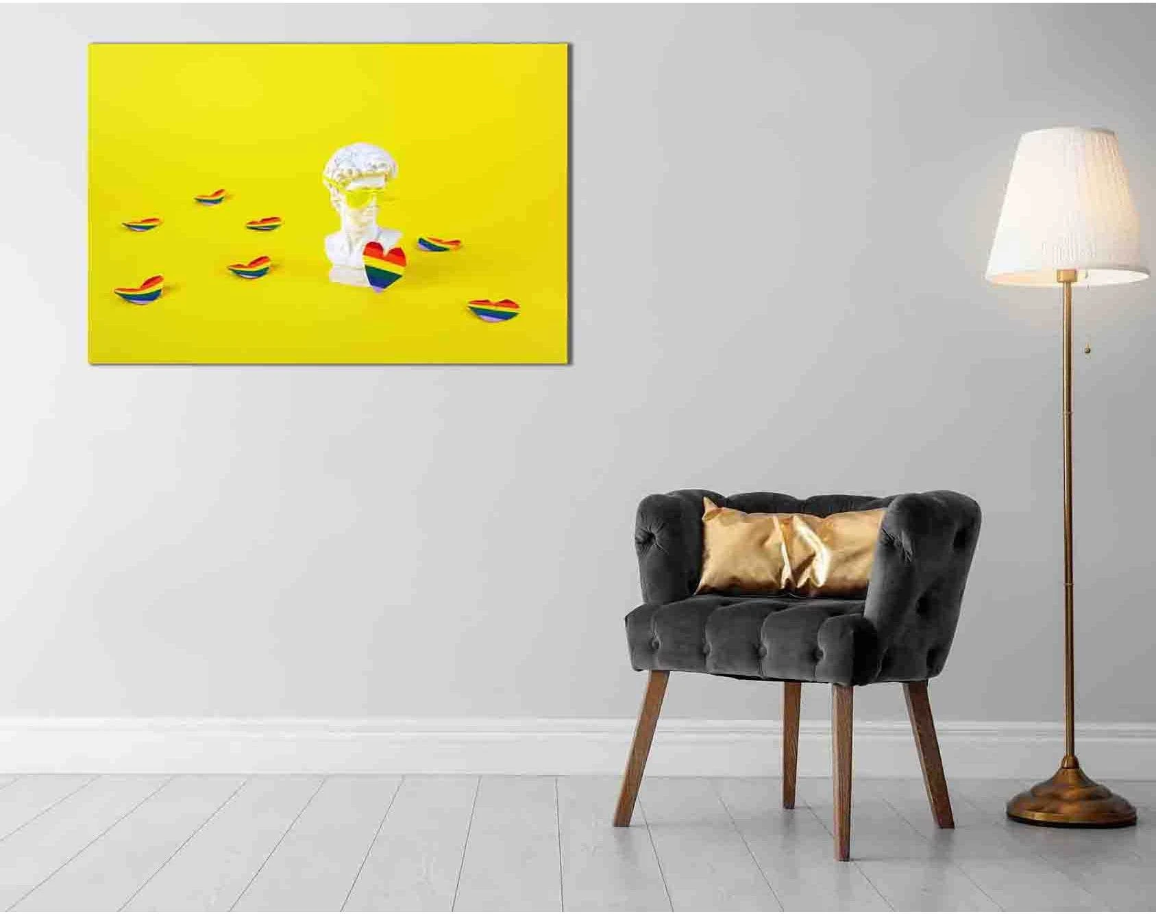 Rainbow pride pop art canvas print with a white bust wearing sunglasses on a bright yellow background with colorful rainbow accents.