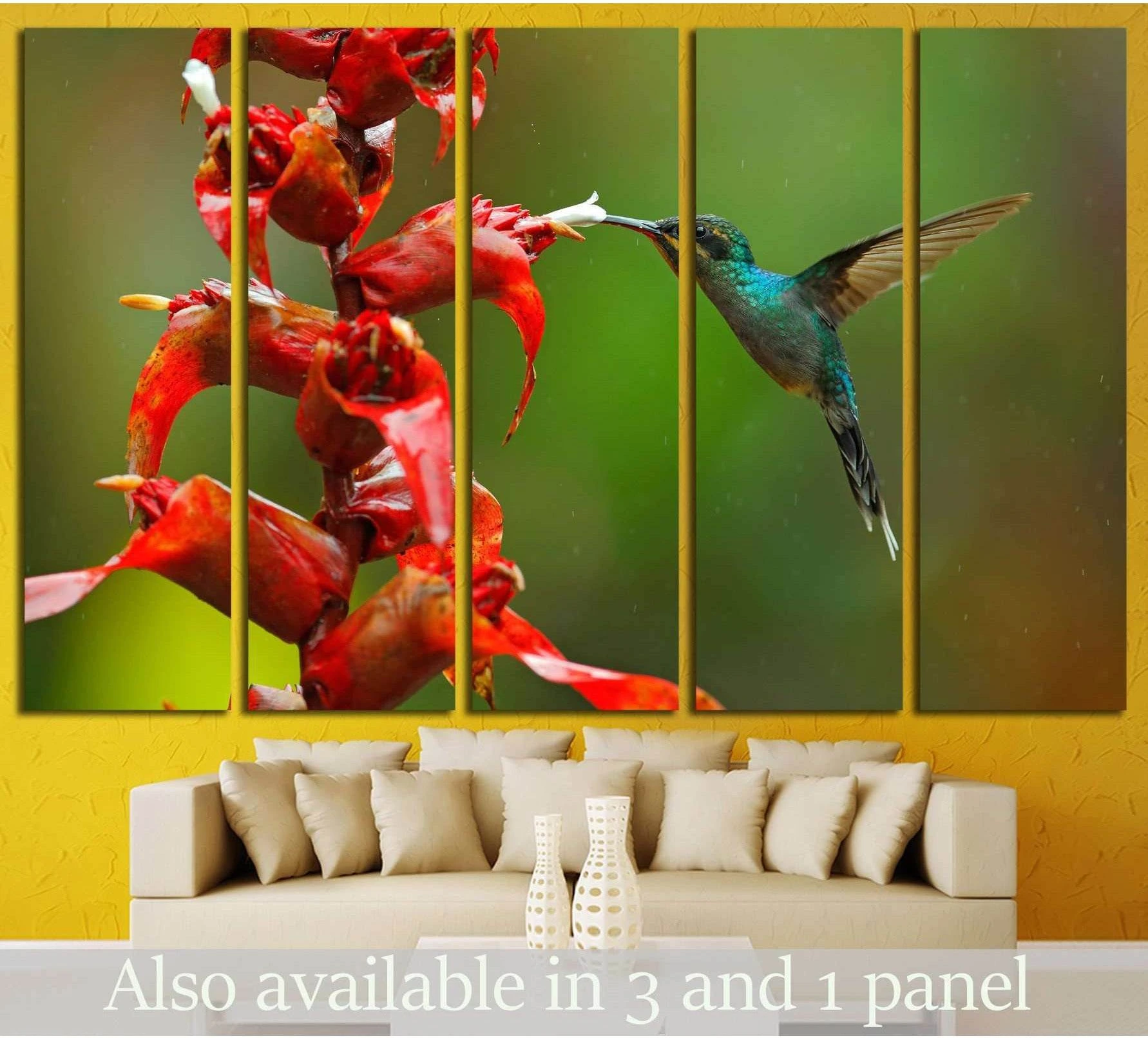 Teal hummingbird canvas print hovering beside vivid red tropical flowers on a soft green background
