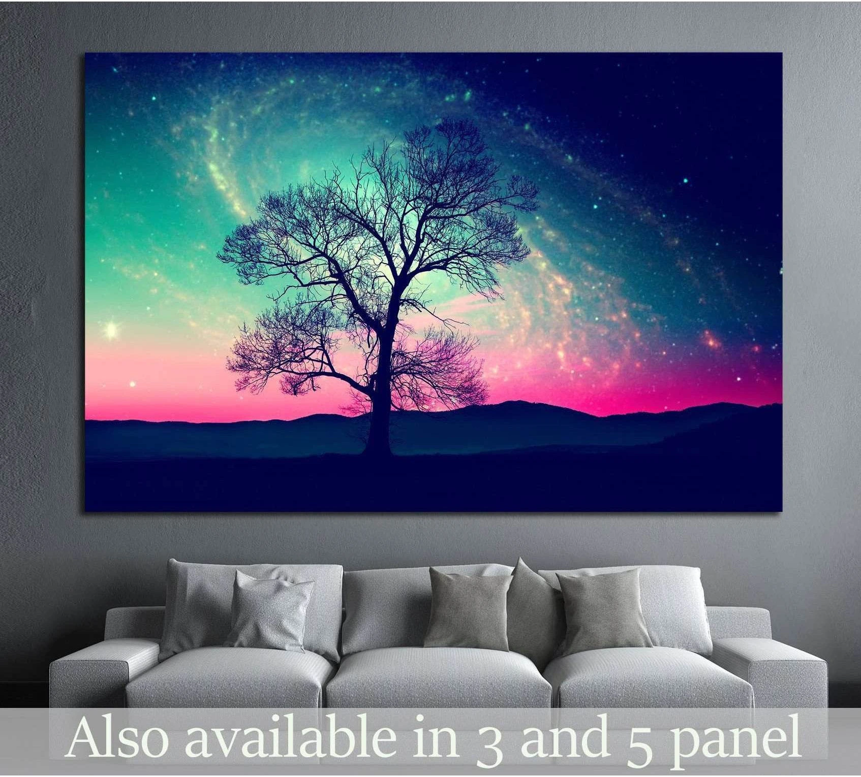 Galaxy tree canvas print with lone silhouetted tree under a teal and pink starry night sky above a sofa