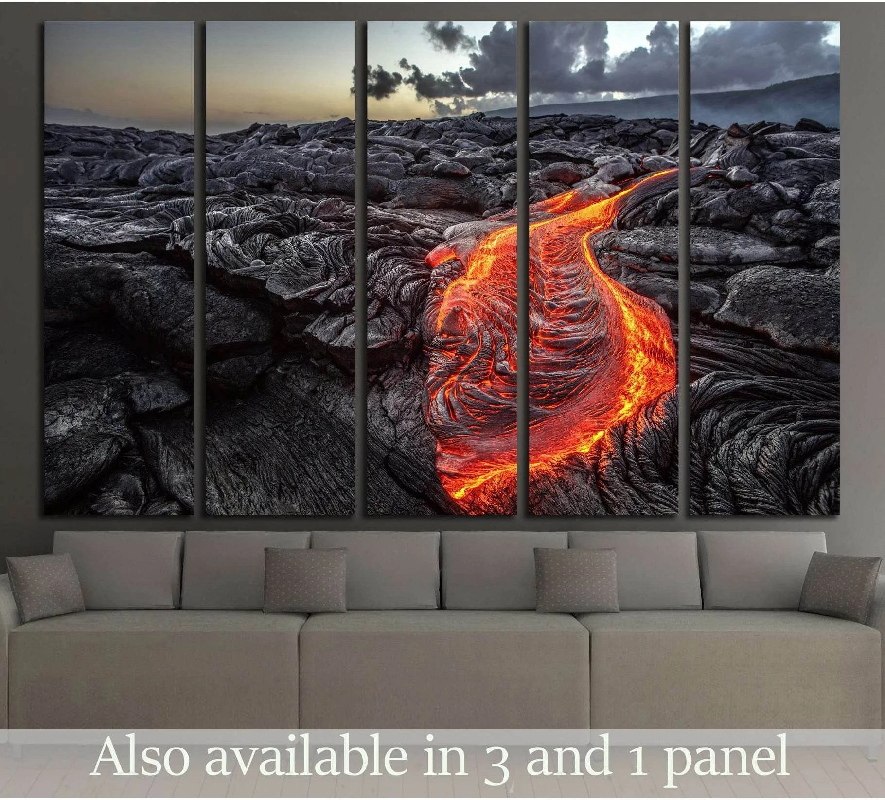 Molten lava canvas print over a sofa, with glowing red-orange flow across a black Hawaii lava field