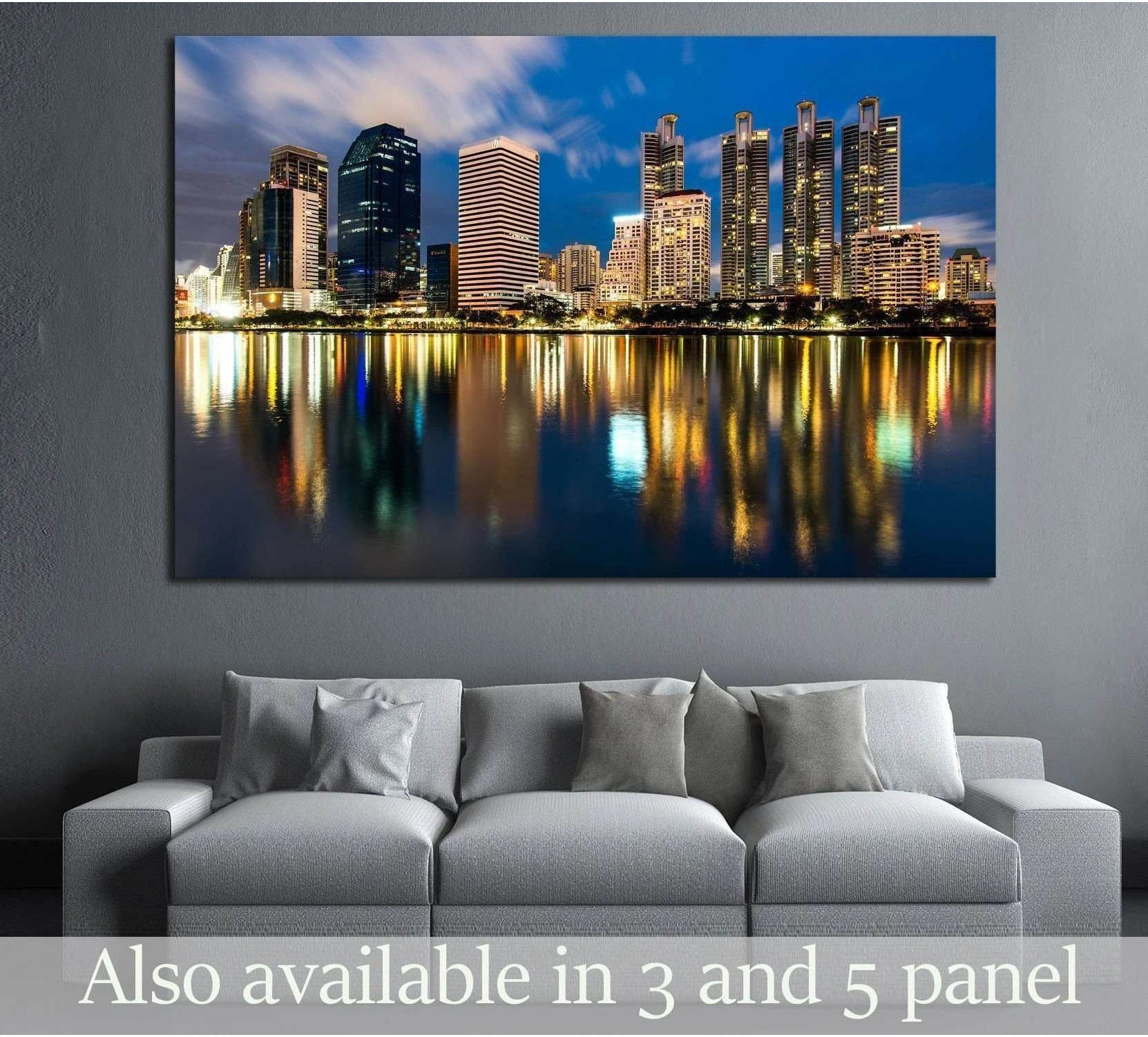 Bangkok skyline canvas print with night city lights reflected on water above a gray sofa