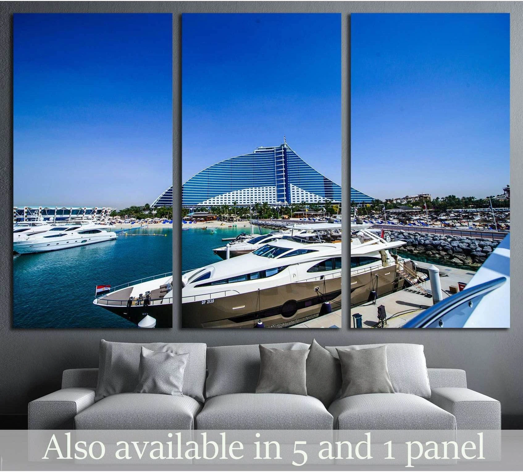 Dubai Jumeirah Beach Hotel canvas print with yachts in the marina, displayed above a sofa