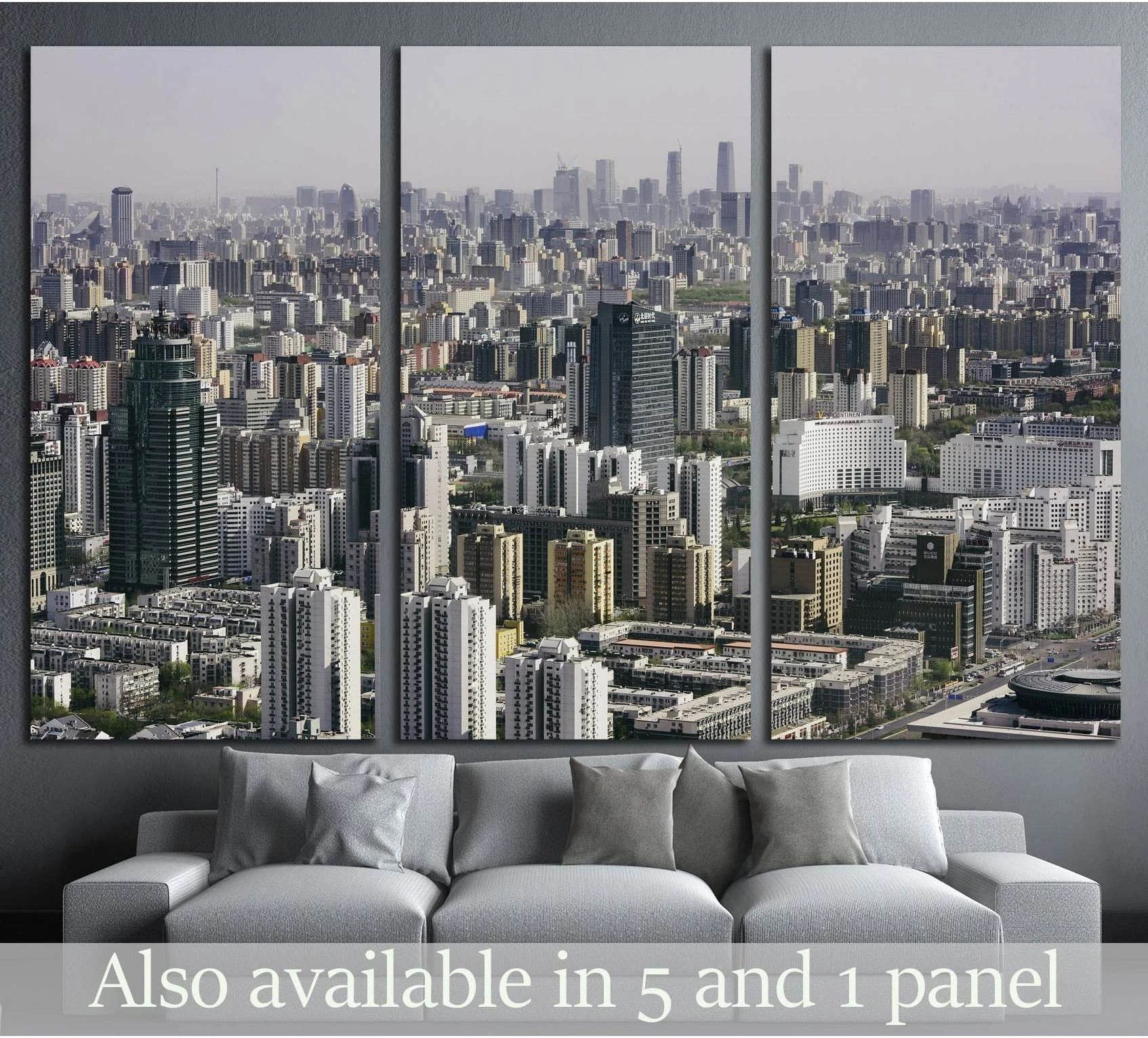 Beijing skyline triptych canvas print with dense residential towers above a sofa in a modern living room