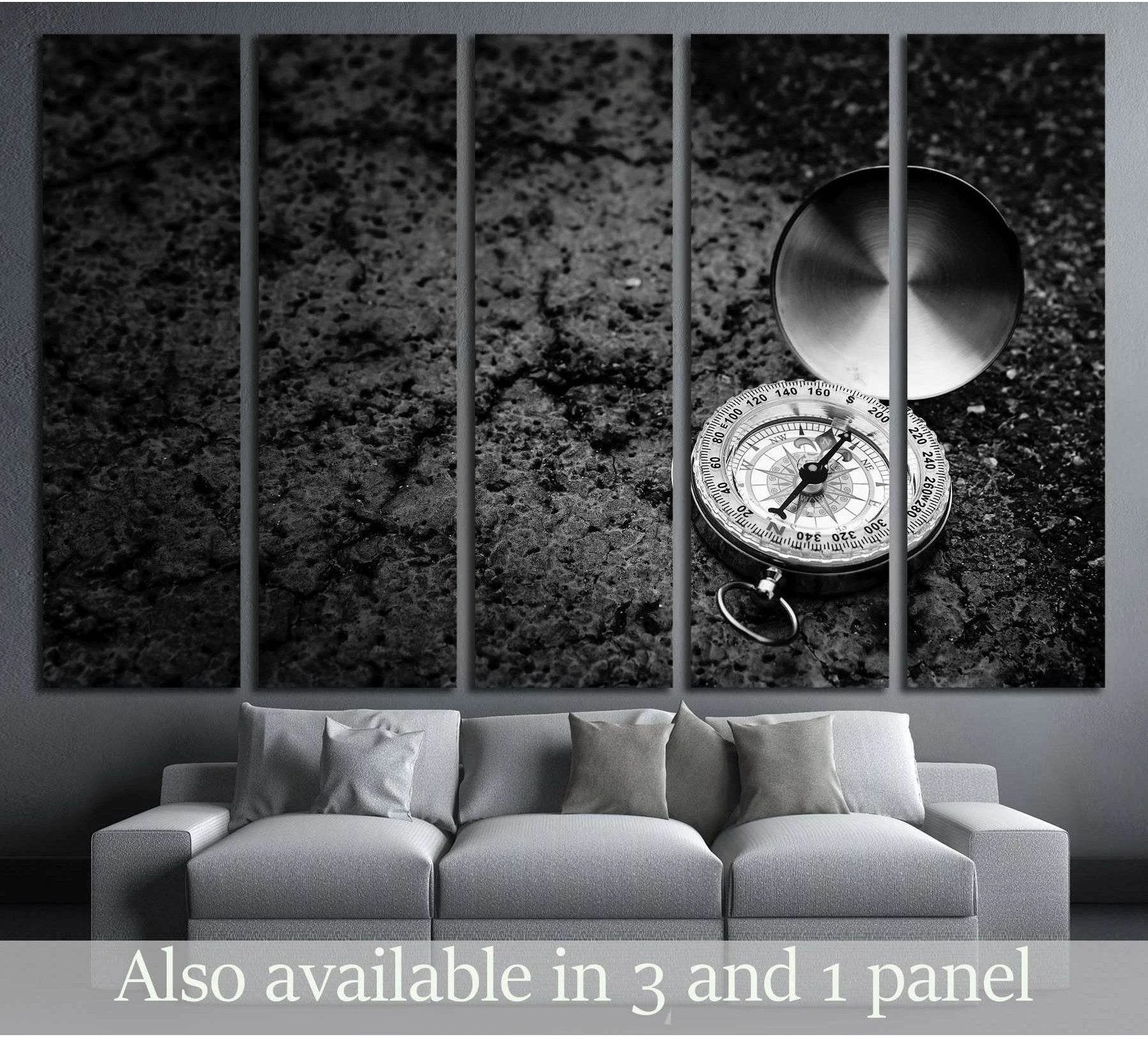 Black and white retro compass canvas print on rough road texture above a sofa