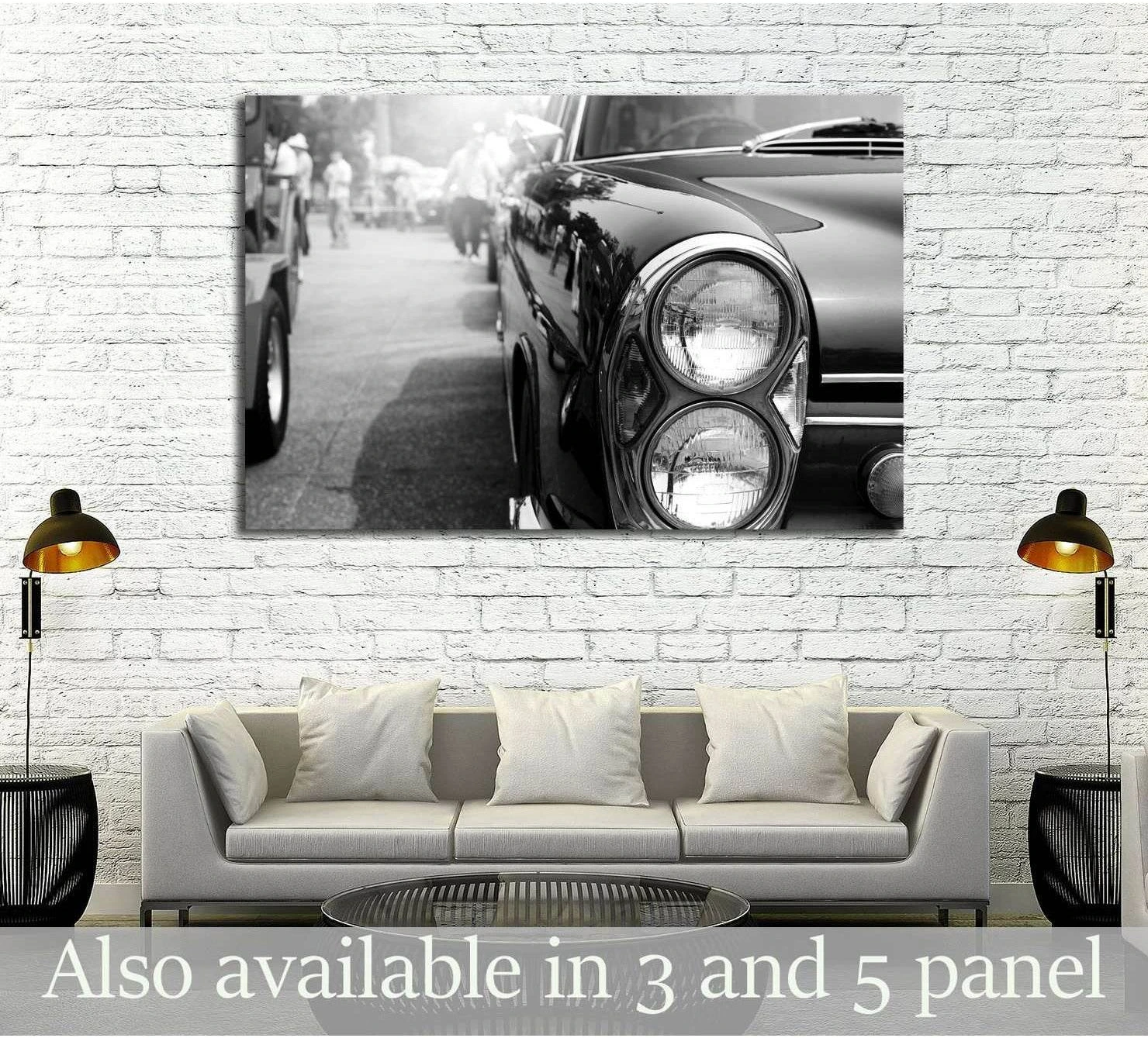 Black and white classic car canvas print with chrome headlights above a sofa in a modern living room