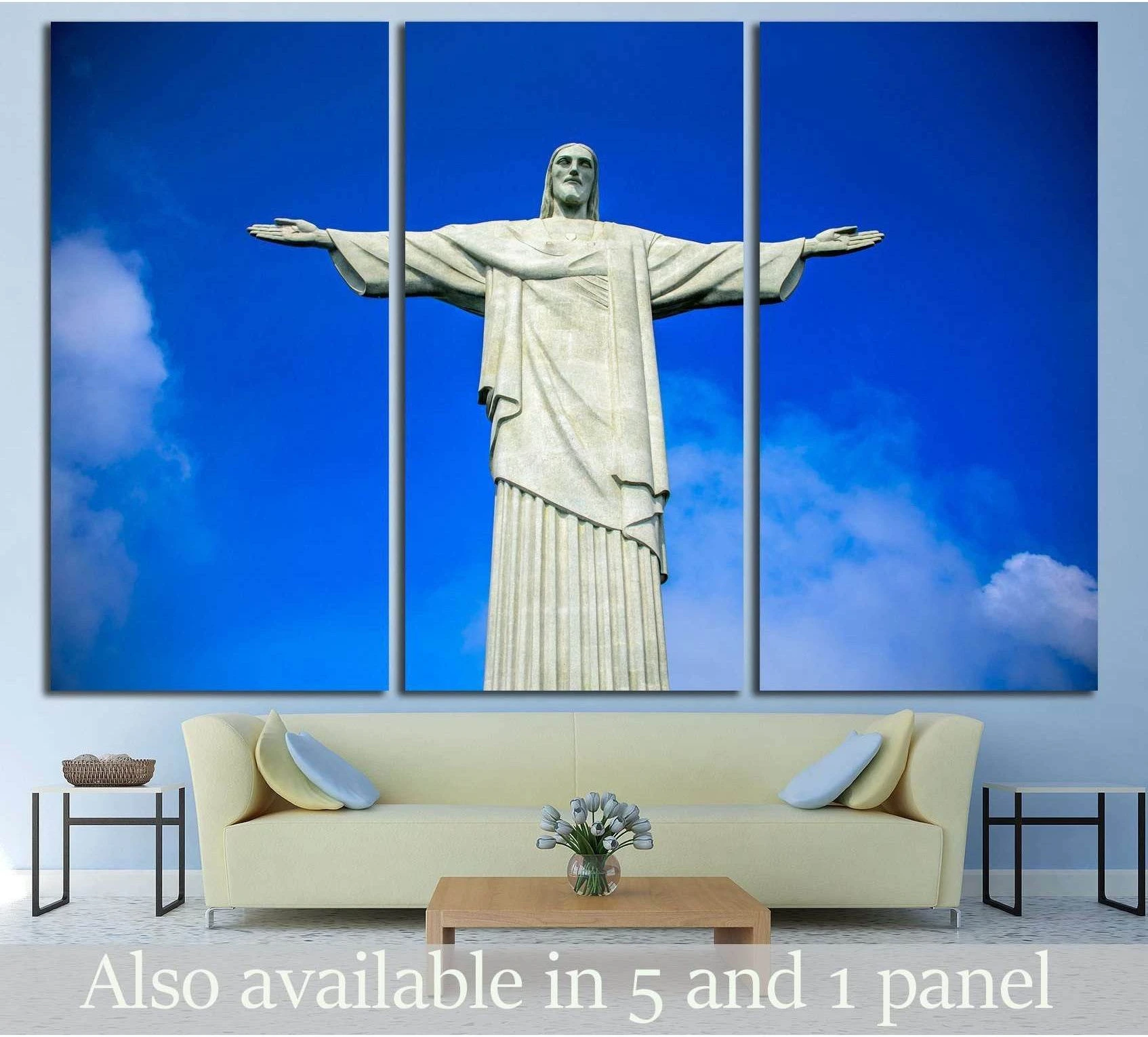 Christ the Redeemer canvas print against a vivid blue Rio sky above a sofa in a modern living room