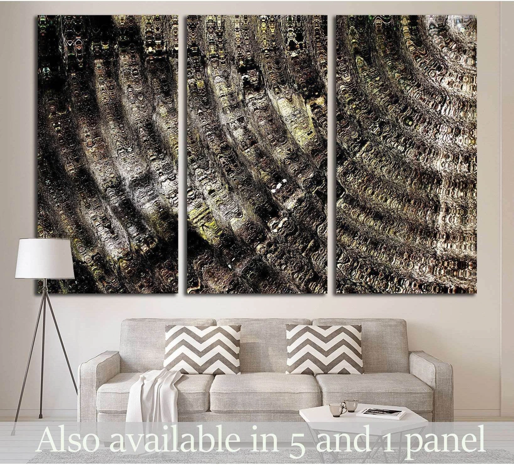Abstract triptych canvas print with dark radial textured pattern above a sofa