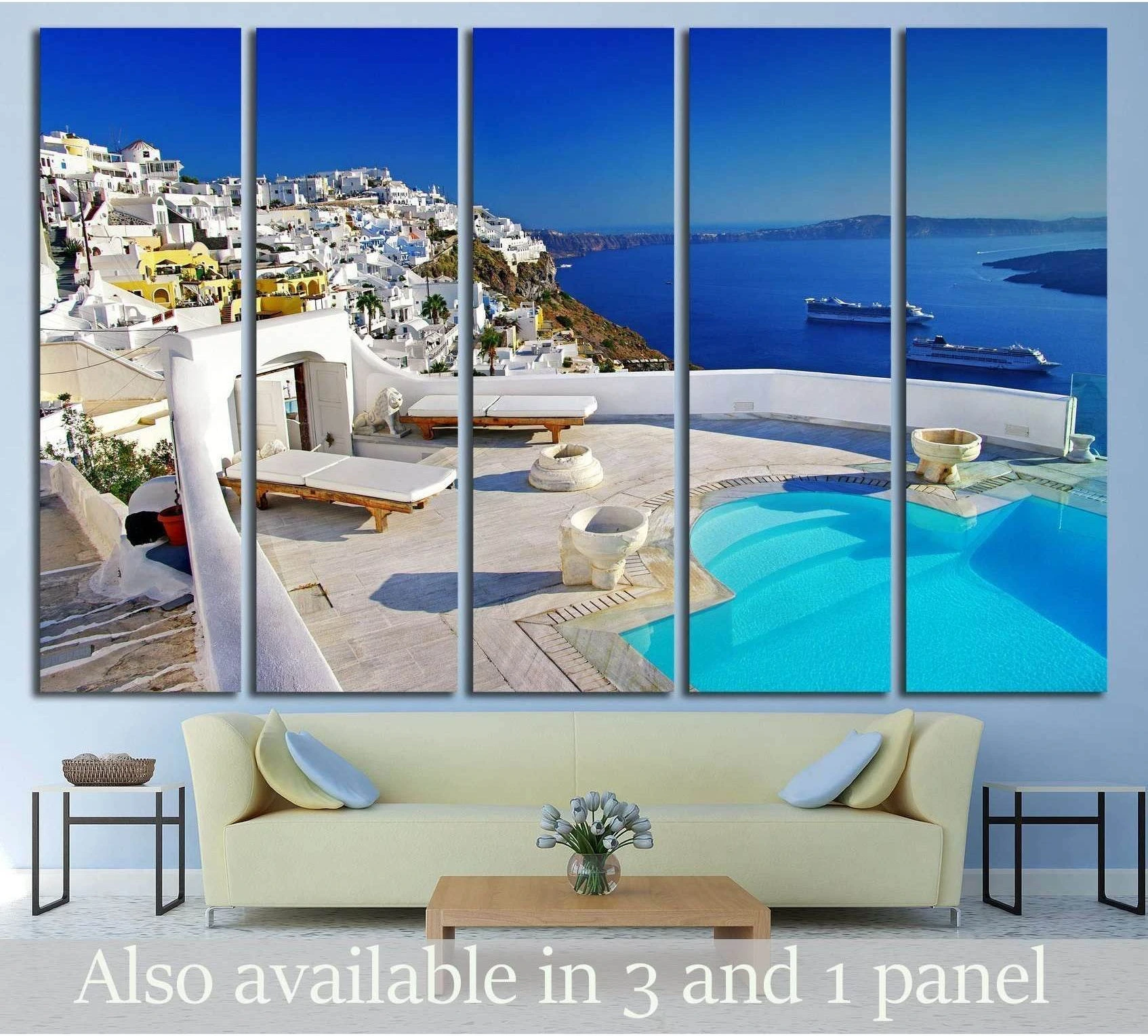 Santorini cliffside pool canvas print with white villas and blue caldera, displayed above a sofa