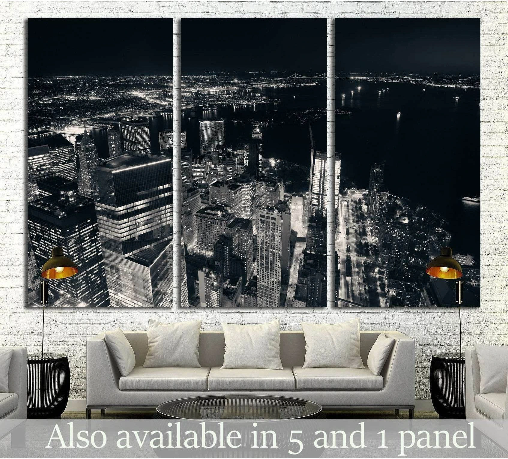 Black and white New York City triptych canvas print above a sofa in a modern living room