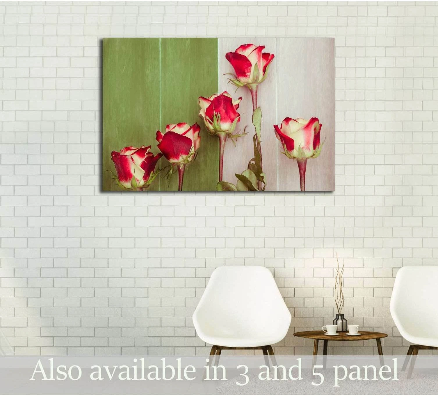 Red and white rose canvas print on green wood background displayed above chairs in a neutral dining room