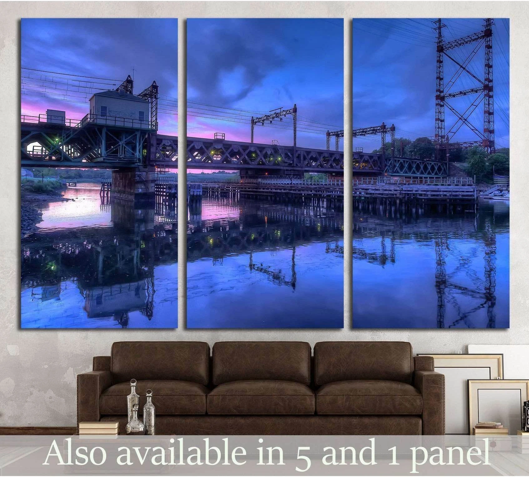 Rusty train bridge over harbor at blue and pink sunset triptych canvas print above brown sofa