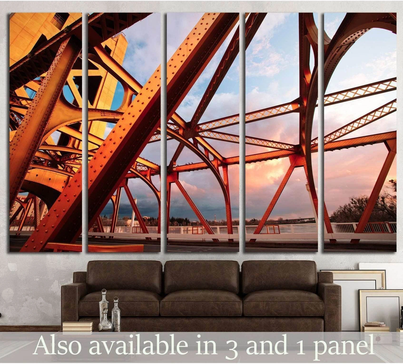 Sacramento bridge canvas print with orange steel beams at sunset above a sofa in a modern living room