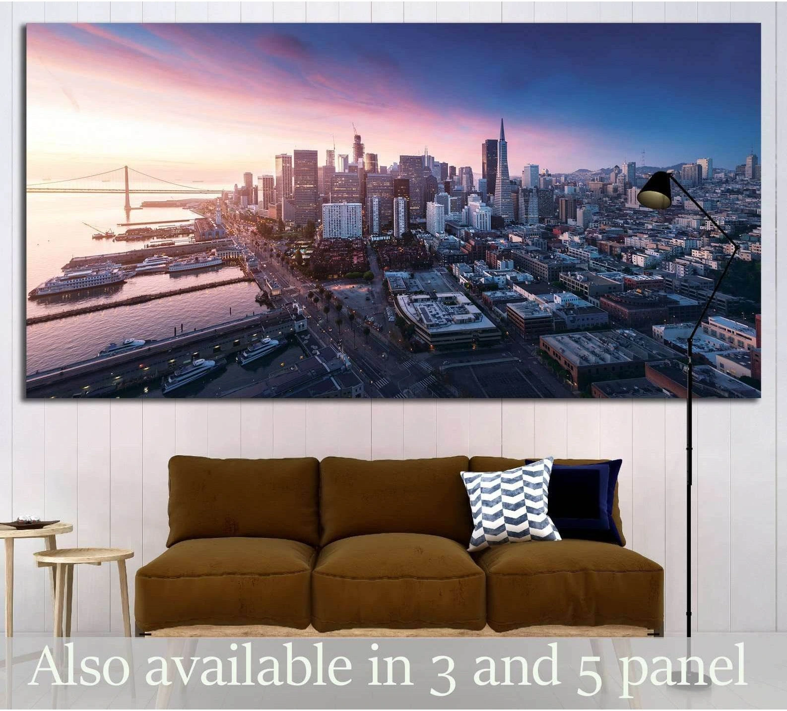 Panoramic San Francisco skyline canvas print at sunrise above sofa in modern living room
