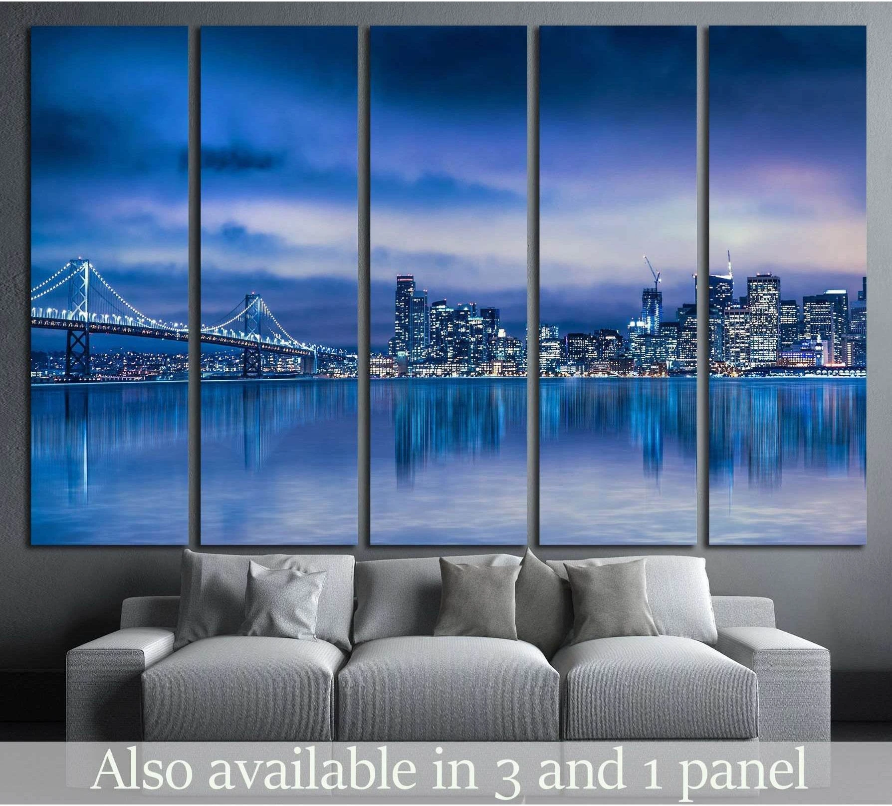 San Francisco skyline and Bay Bridge canvas print in blue night tones above a gray sofa