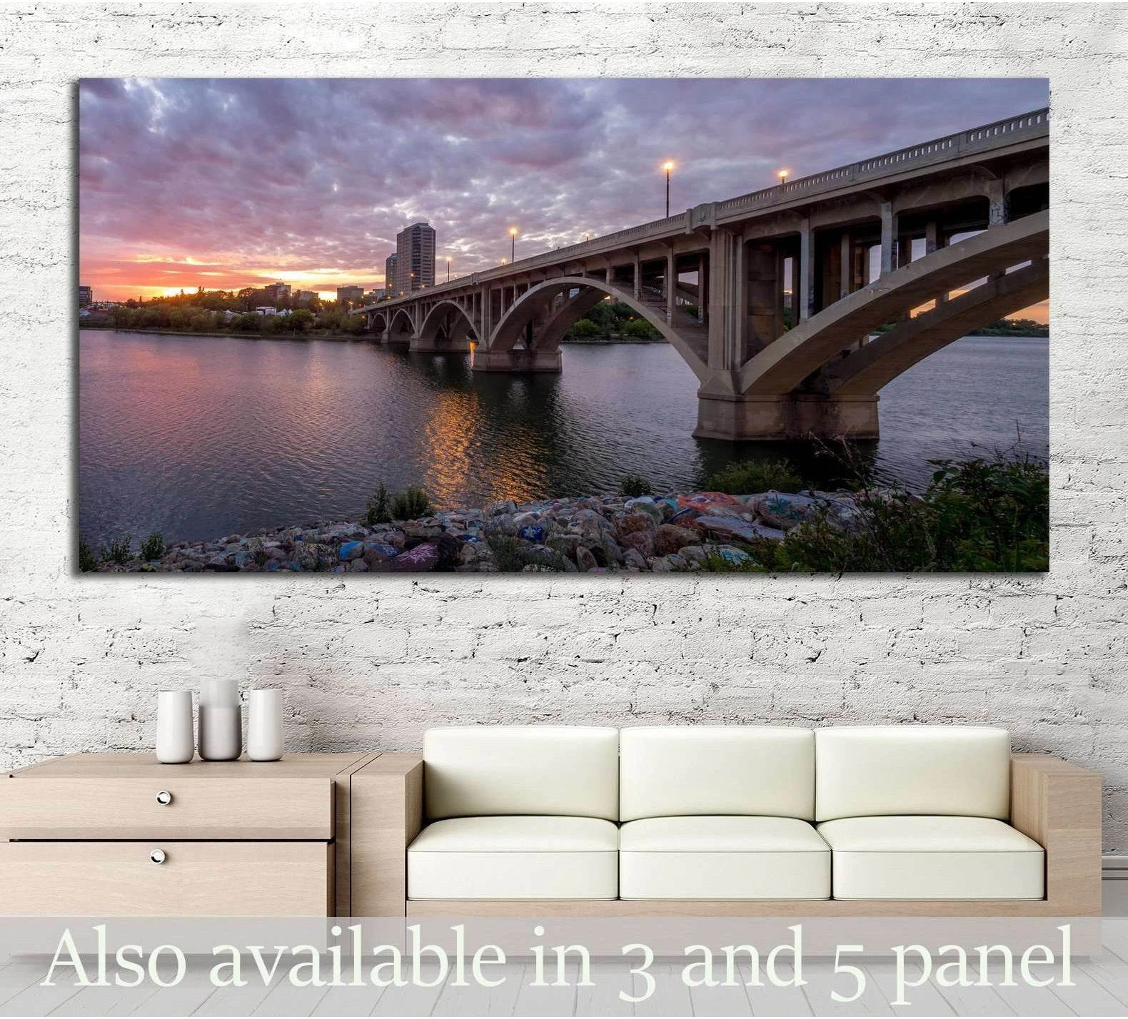Saskatoon bridge and Saskatchewan River dusk canvas print above sofa in modern living room
