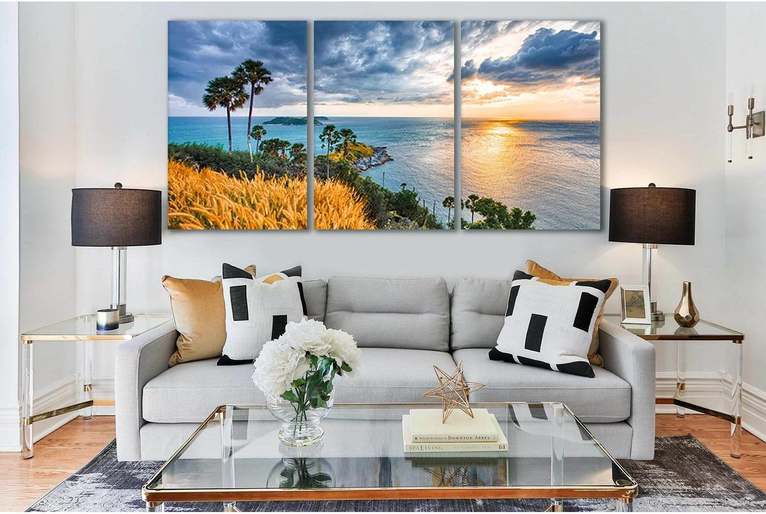 Sunrise ocean seascape in blue and gold with palm trees, clouds and golden grasses detail view