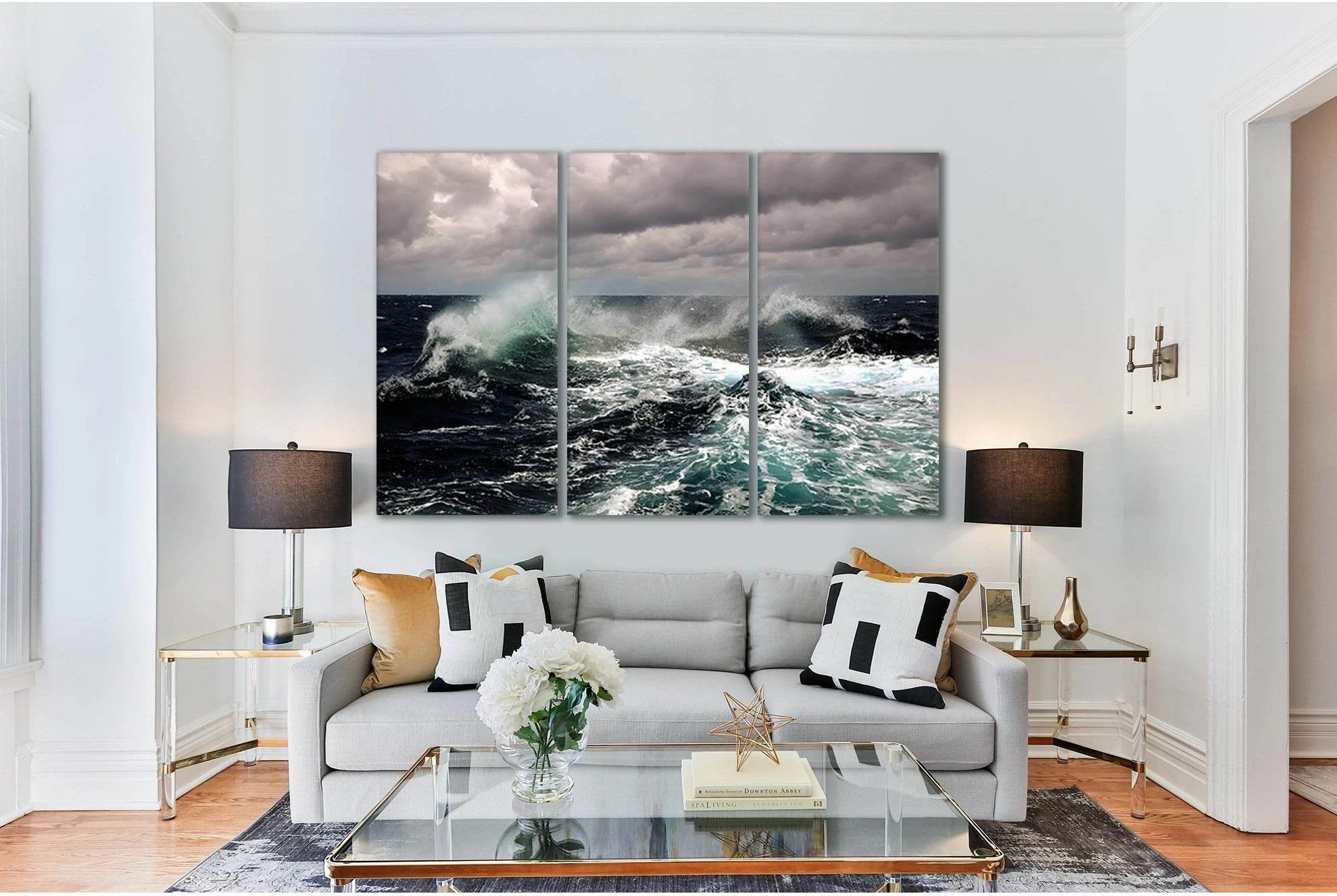Stormy ocean waves with teal water and white foam beneath grey storm clouds detail view