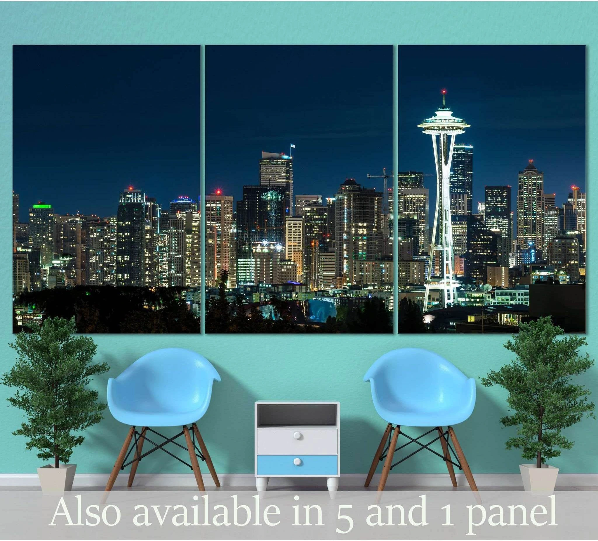 Seattle skyline triptych canvas print with Space Needle at night above chairs in a modern living room