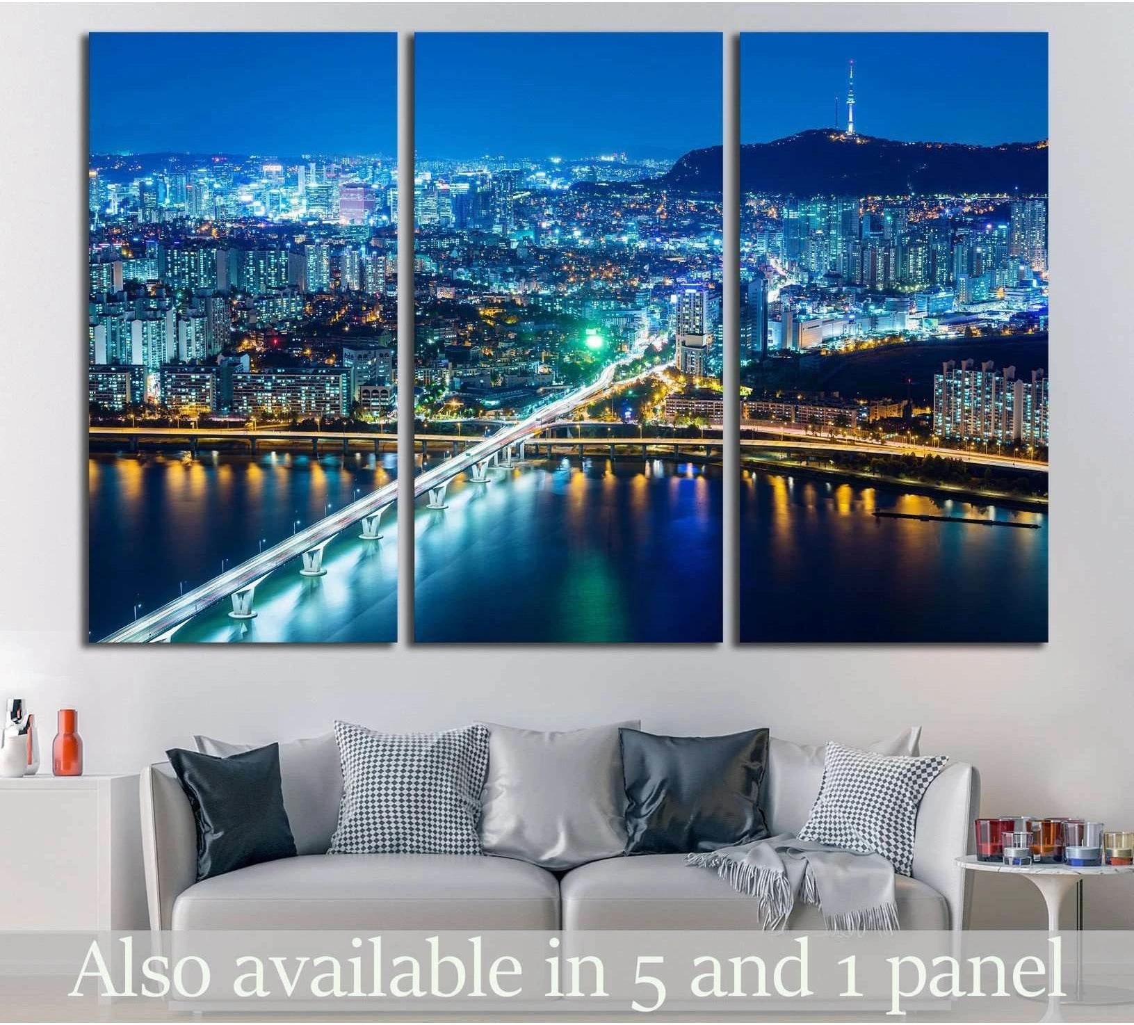 Seoul night skyline canvas print with Han River bridge and Namsan Tower above a sofa in a modern living room