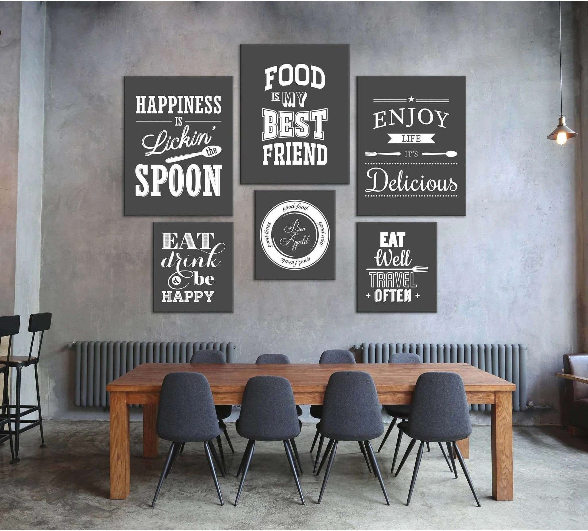 Six-piece kitchen quote canvas print set in black chalkboard style above a dining table