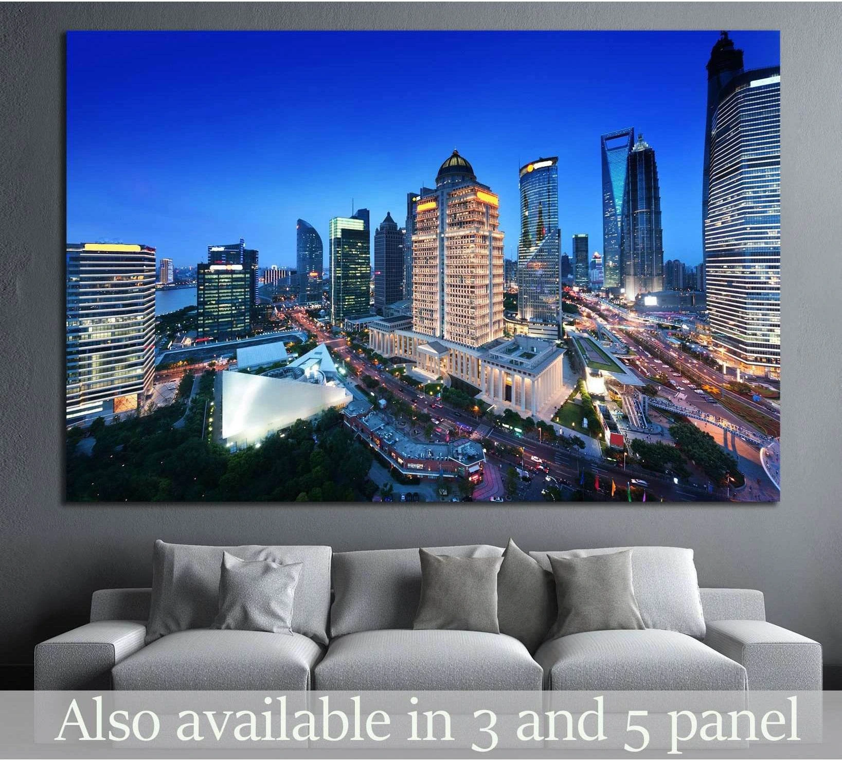 Shanghai skyline canvas print with illuminated skyscrapers at night above a modern sofa