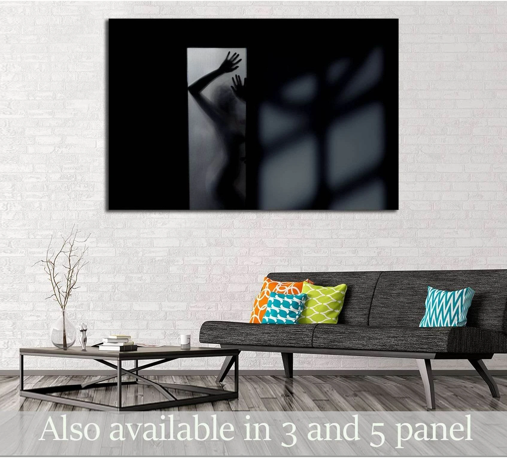 Woman silhouette canvas print behind frosted glass with deep shadows above sofa in modern living room