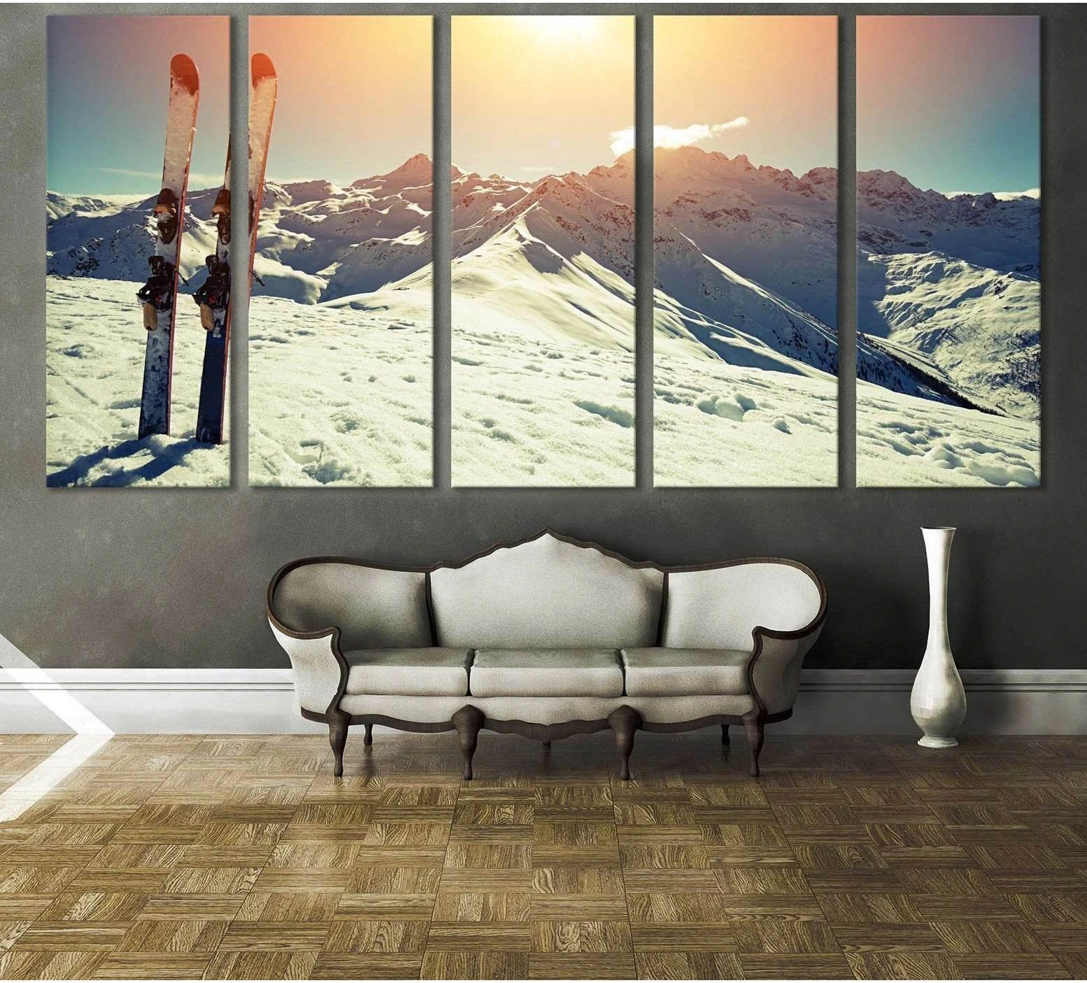 Skis planted in snow on an alpine ridge at sunset canvas print, displayed above a sofa