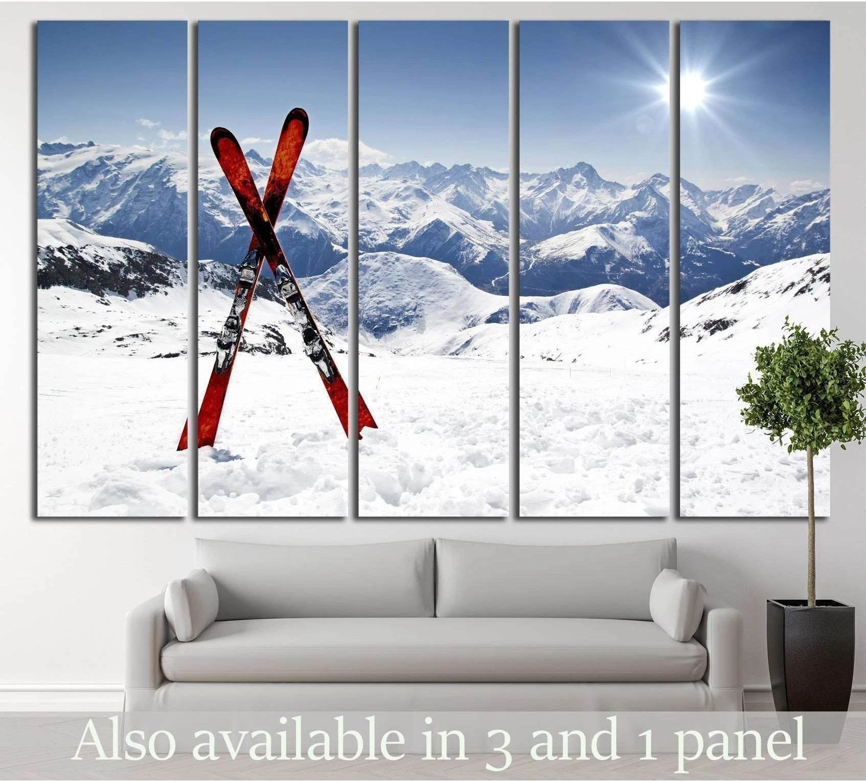 Crossed red skis in alpine snow canvas print above sofa in a modern living room
