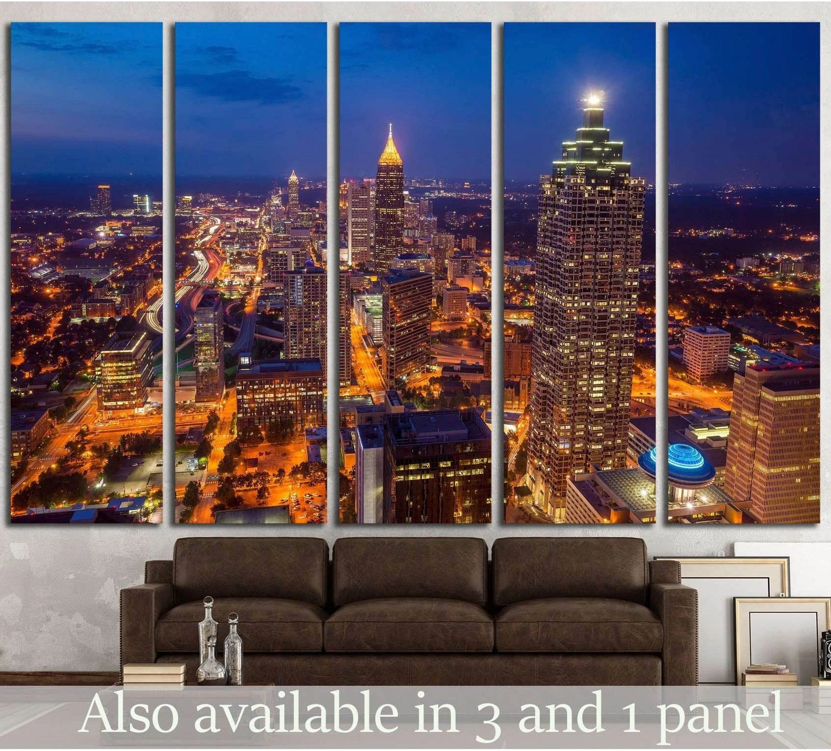 Atlanta skyline canvas print at night in five-panel layout above a sofa in a modern living room