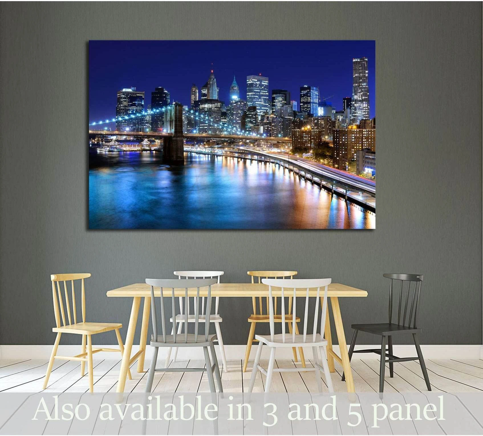 New York skyline canvas print with bridge lights above a dining table in a modern room