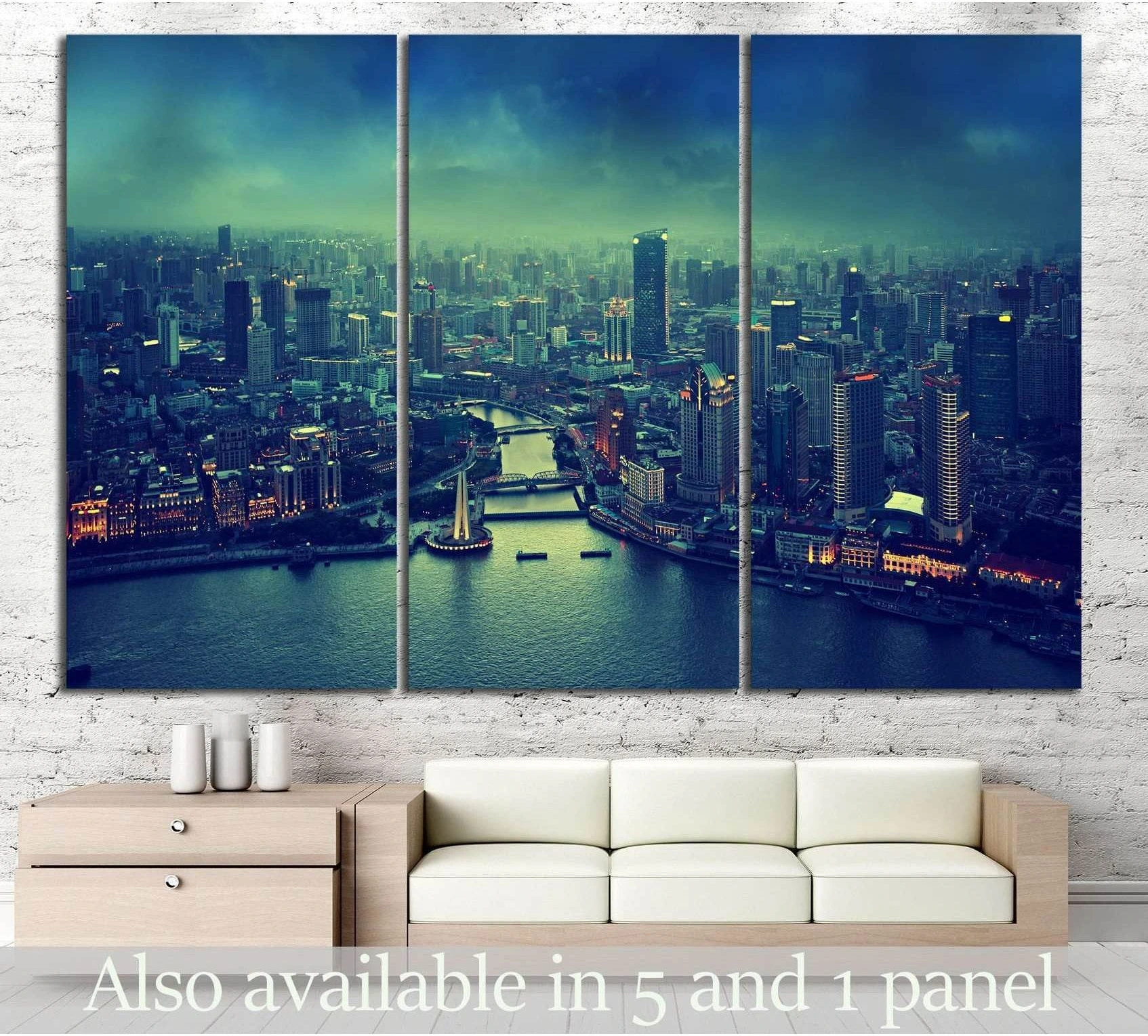Shanghai skyline triptych canvas print in teal night tones above sofa in modern living room