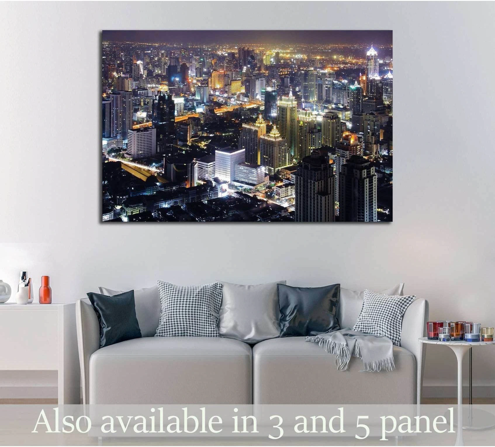 Bangkok night skyline canvas print above sofa in a modern living room with glowing downtown skyscrapers