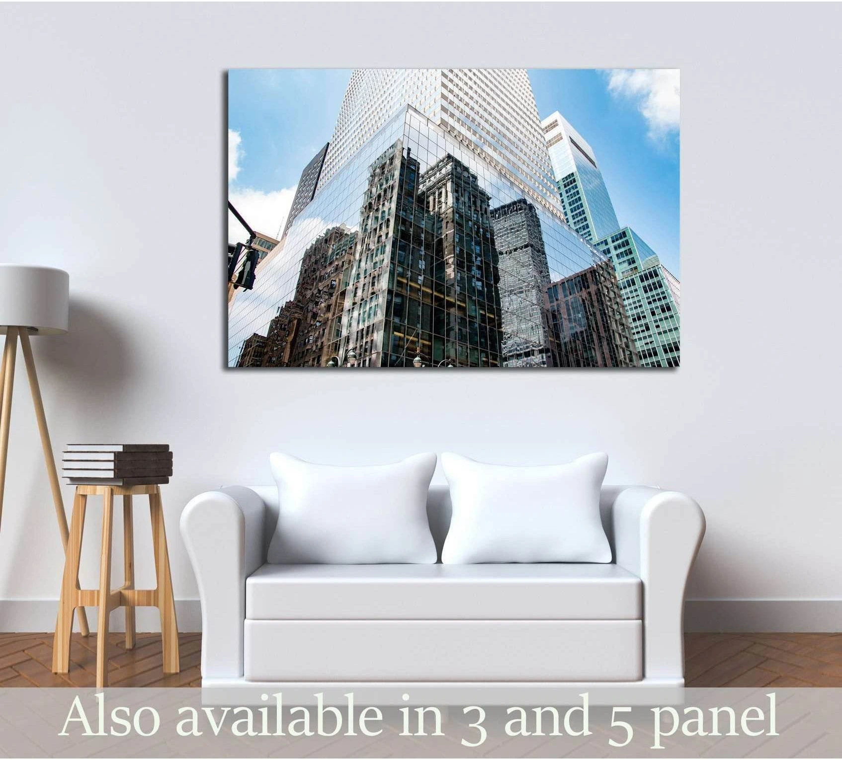 Lower Manhattan skyscrapers canvas print with reflective glass towers above a white sofa