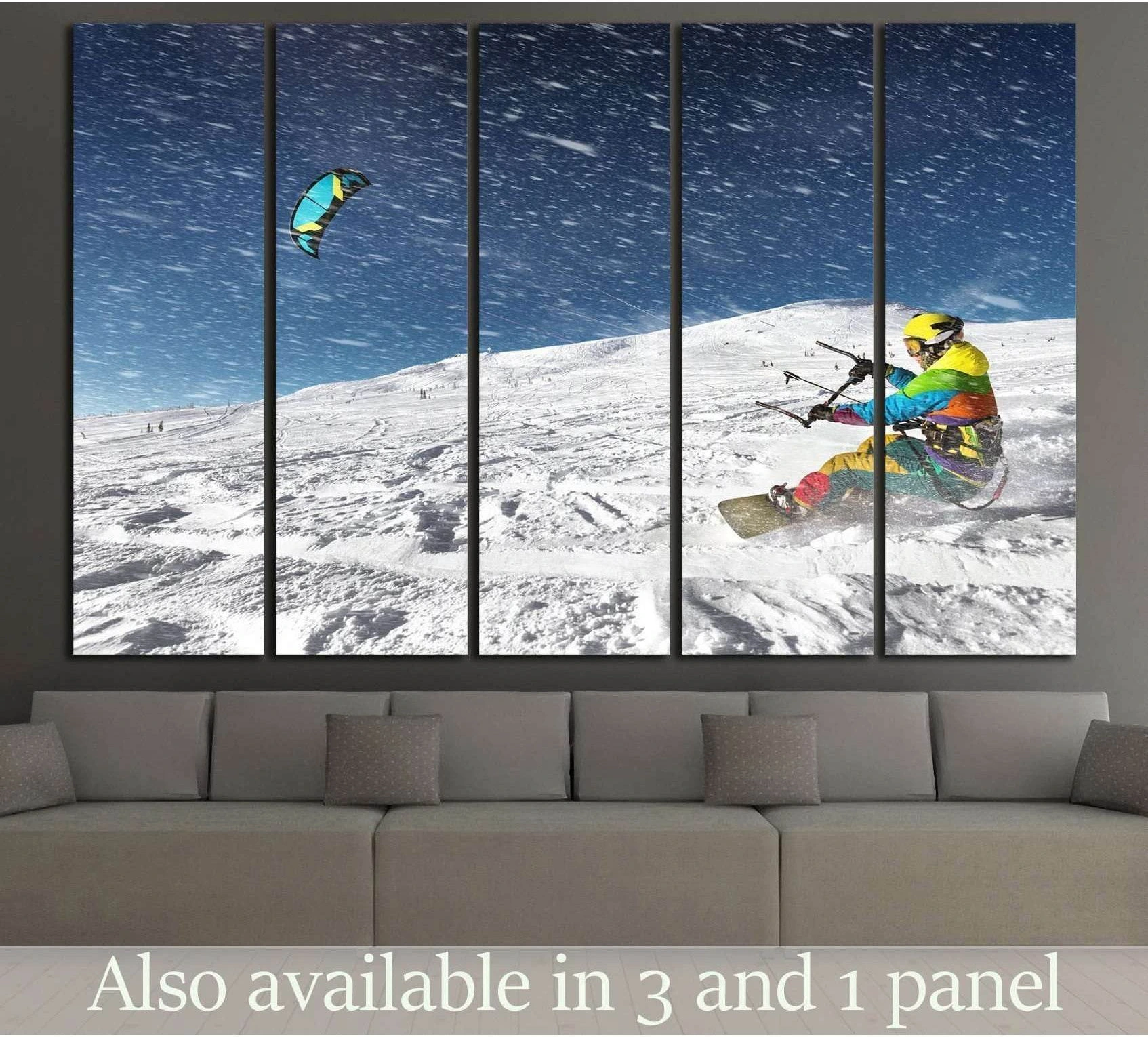 Snowkiting canvas print with rider on snowy alpine slope under blue sky, displayed above sofa