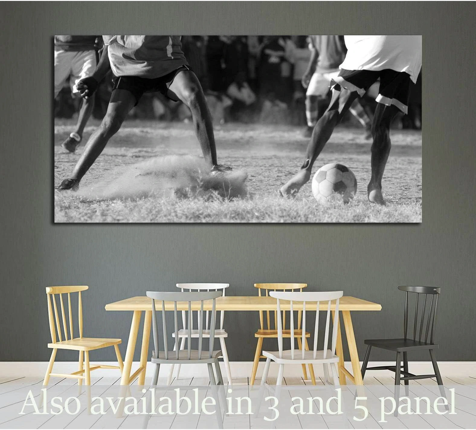 Black and white soccer match canvas print with players kicking through mud on a football field