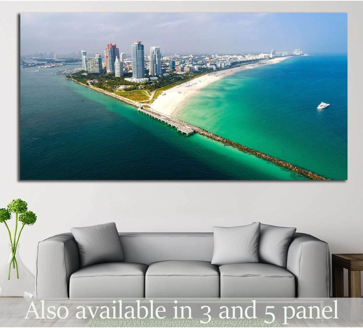South Beach aerial panorama canvas print with Miami shoreline above a sofa in a coastal living room