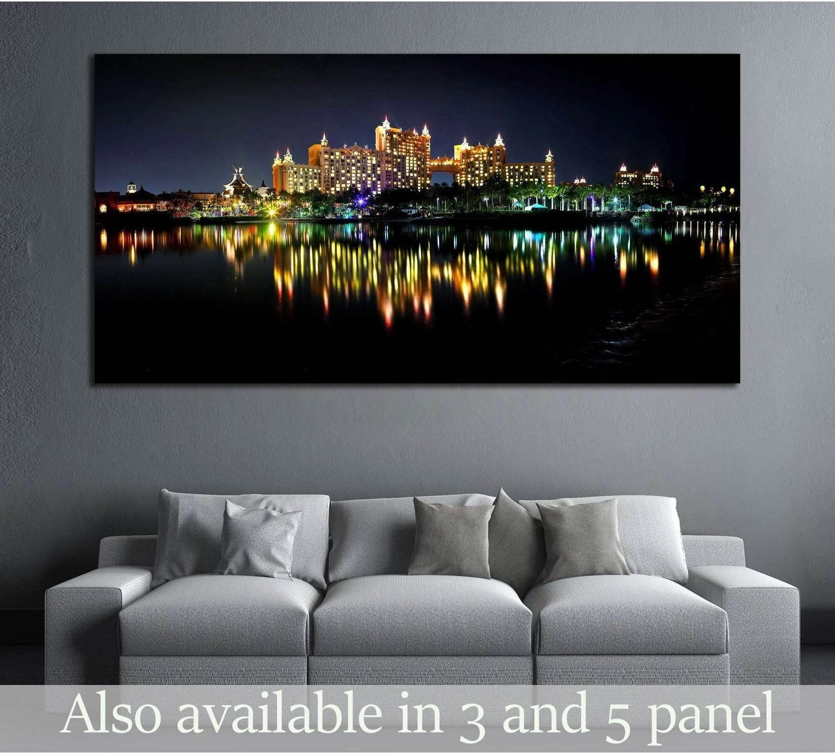 Atlantis Bahamas night skyline canvas print with colorful water reflections above a gray sofa