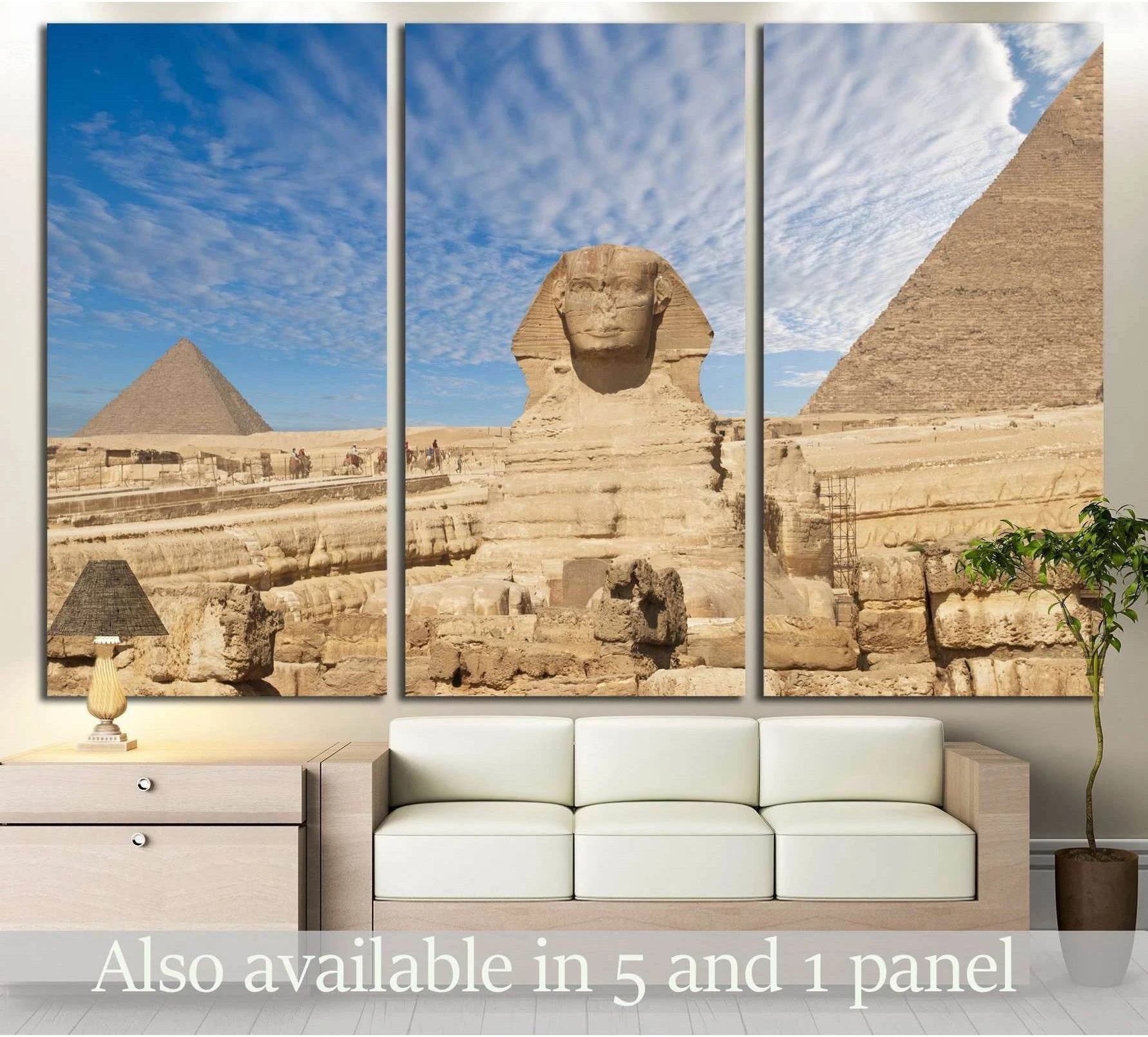 Great Sphinx and Giza pyramids triptych canvas print above sofa in a neutral living room