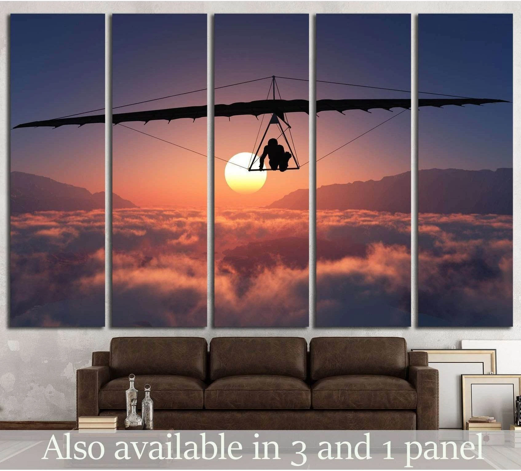 Tandem hang glider canvas print at sunset above clouds, hung above a sofa