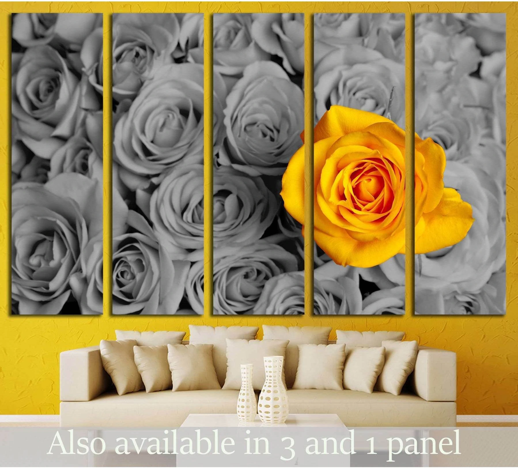 Yellow rose canvas print with selective color bloom above sofa in a modern living room