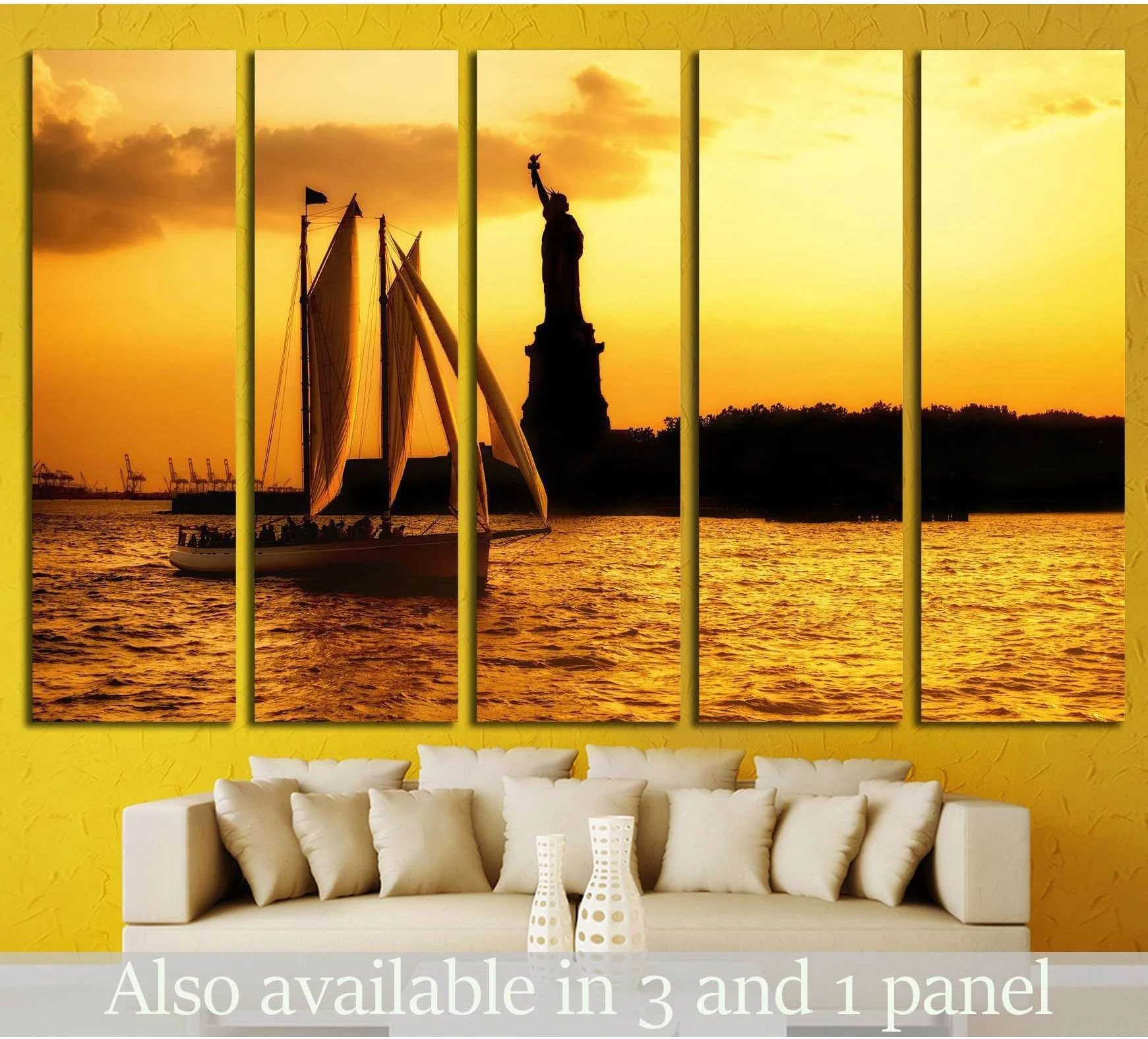 Statue of Liberty and sailboat canvas print at golden sunset above a sofa in a modern living room