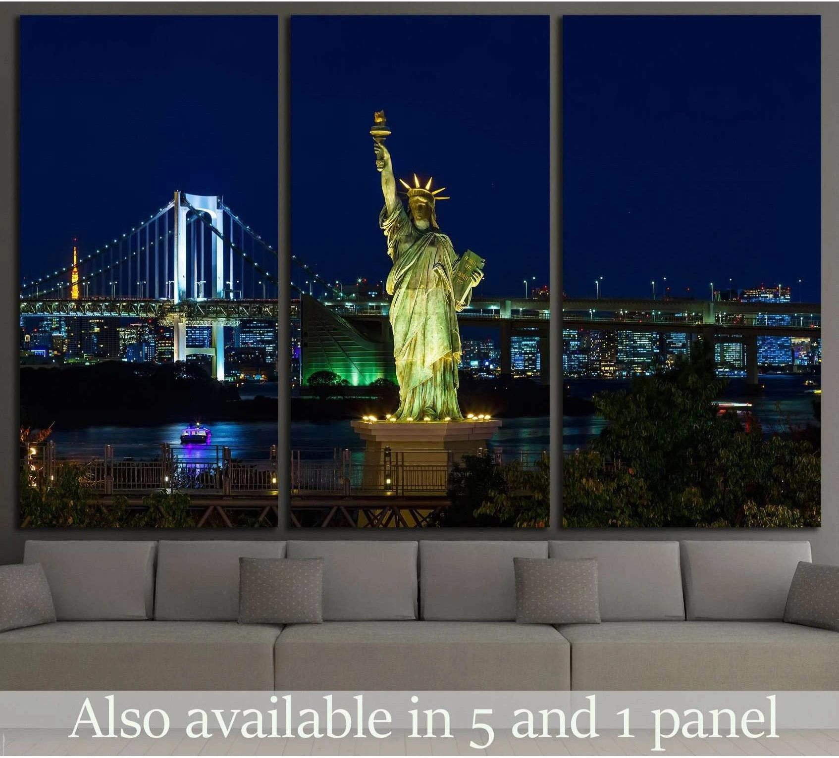 Odaiba Statue of Liberty canvas print with Rainbow Bridge at night above a sofa