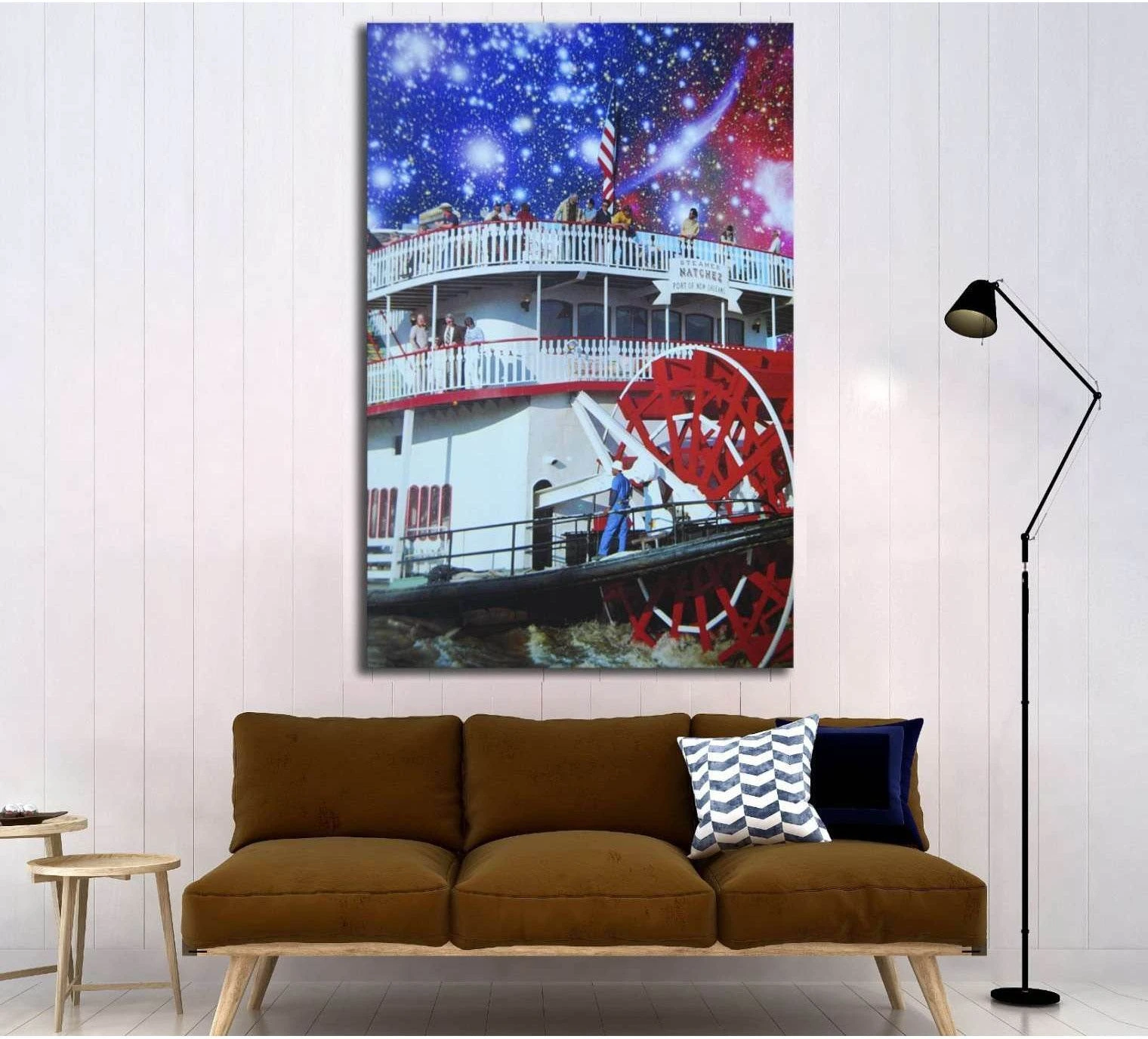 Natchez steamboat canvas print with red paddlewheel under a starry blue and purple night sky above a sofa