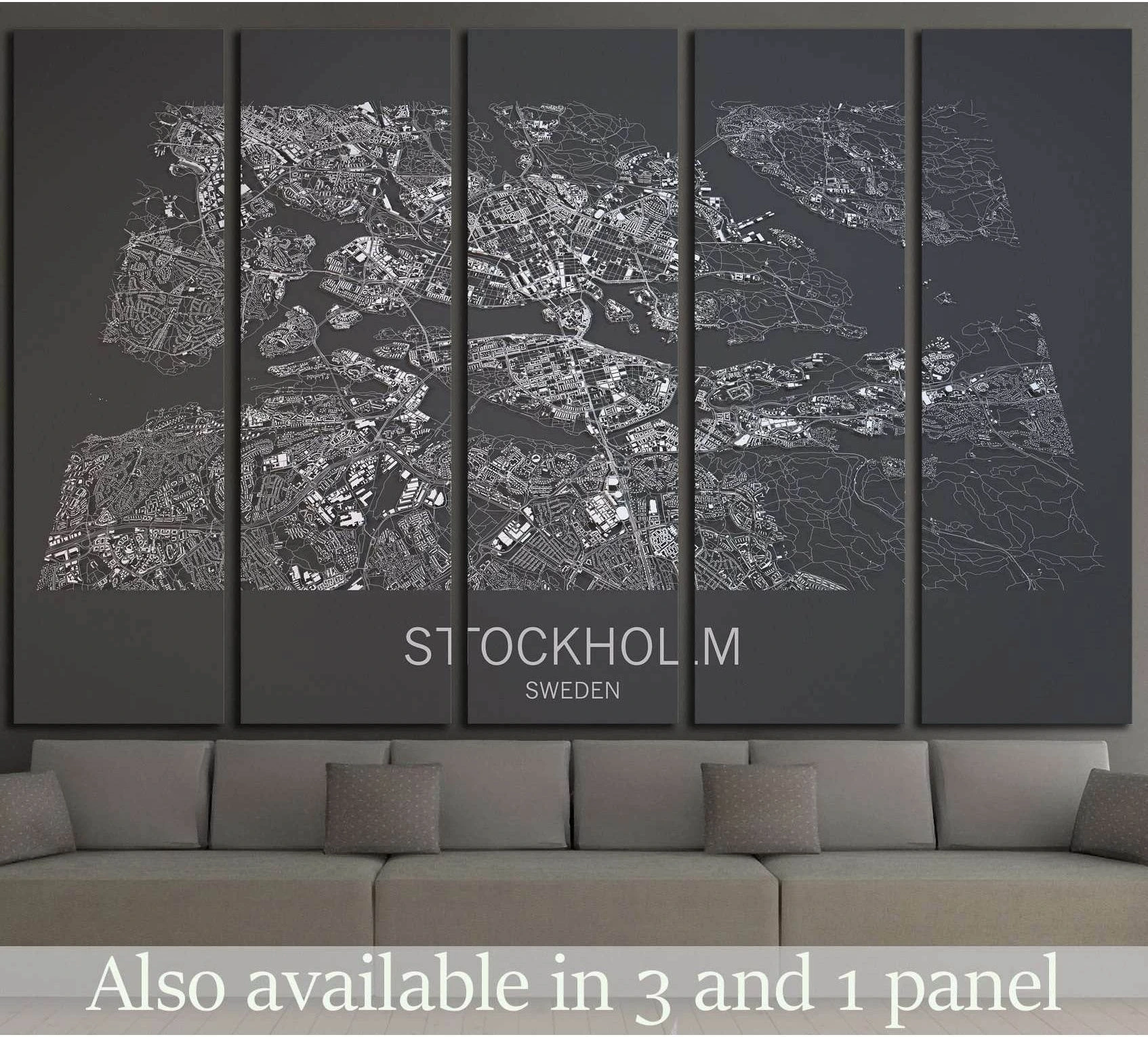 Black and white Stockholm satellite map canvas print hung above a sofa in a modern living room