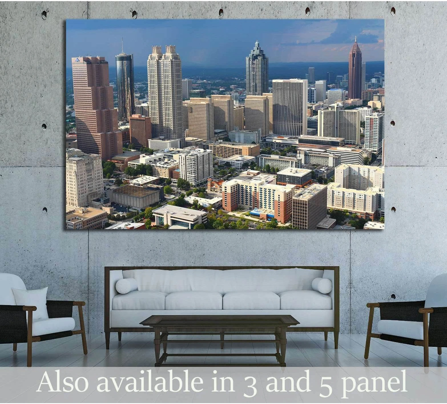 Atlanta skyline canvas print with downtown skyscrapers under storm clouds, hung above a sofa