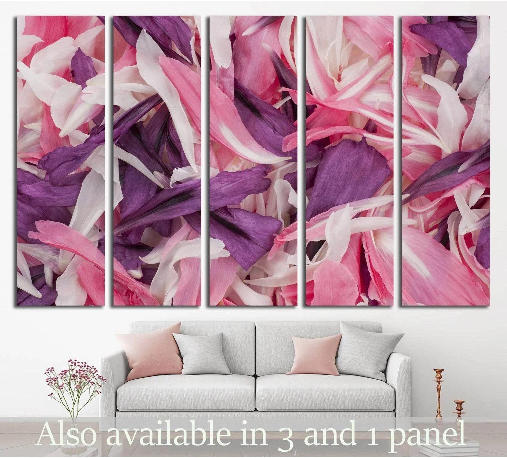 Pink and purple poppy petals canvas print displayed above a sofa in a soft modern living room