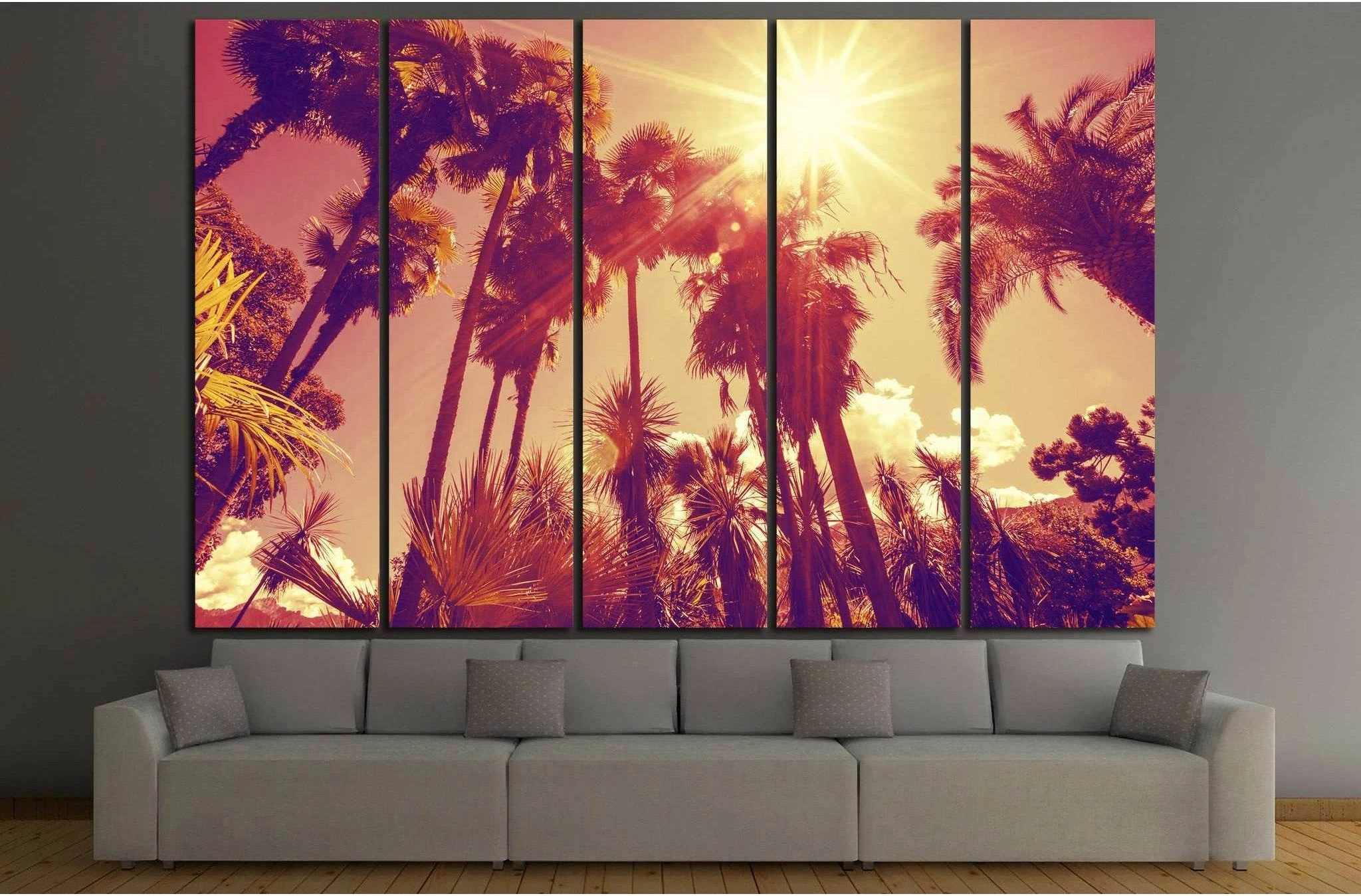 Triptych palm trees with a bright sunburst flare and warm tropical sky detail view