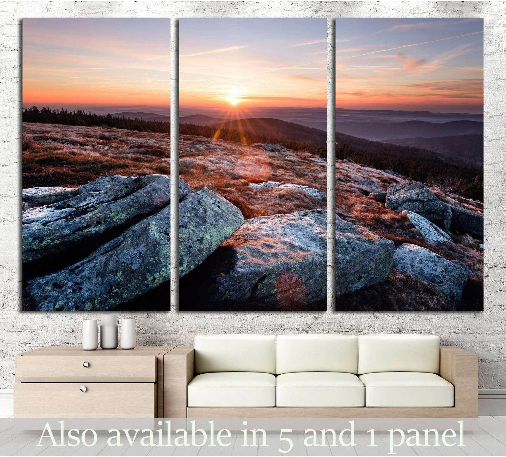 Brocken mountain sunrise triptych canvas print with rocky foreground above sofa