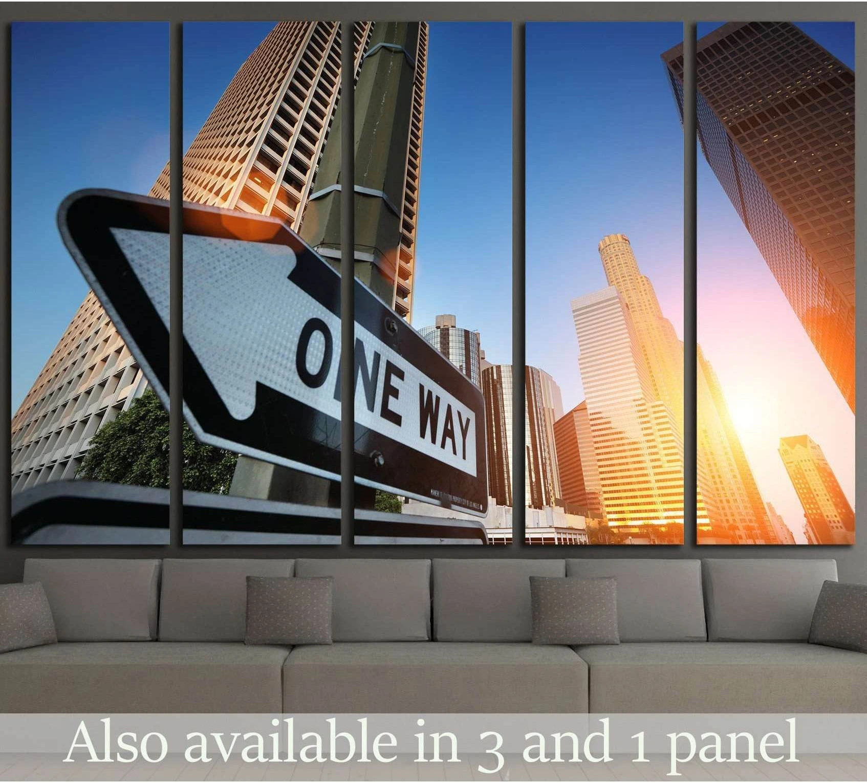 Los Angeles skyline canvas print with One Way sign at sunrise above sofa in modern living room